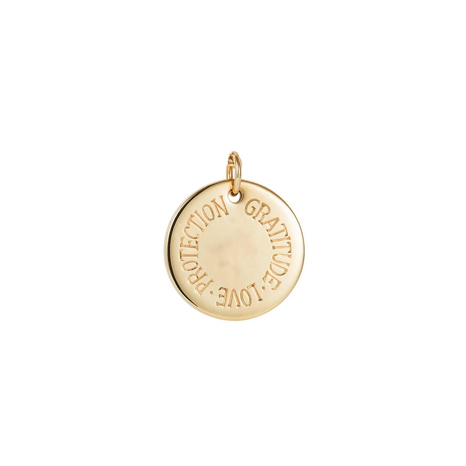 Beautiful and classic 9 karat gold charm disc set with white diamond. This gold charm has powerful words hand engraved around the disc to help protect its wearer.  

Hand made and hand engraved in England by experienced work shops in Hatton Garden,