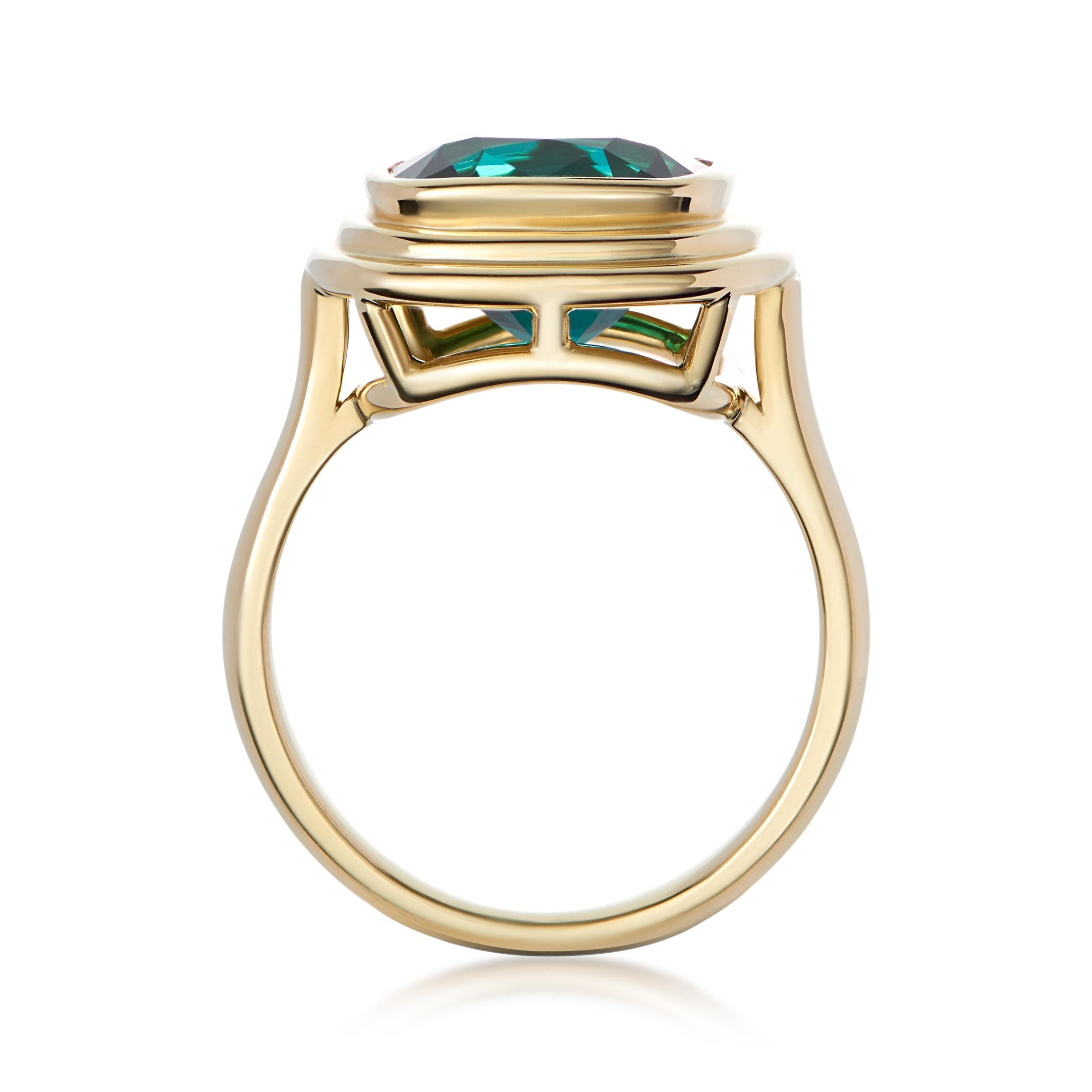 The most incredible stone - a very unusual vivid, blue/ green tourmaline 
- 6ct cushion cut Tourmaline 
- 18k yellow gold 
- Size O (7.25 USA) - Complimentary resizing on request 

The latest collection from Minka is the Athena collection. 
Inspired