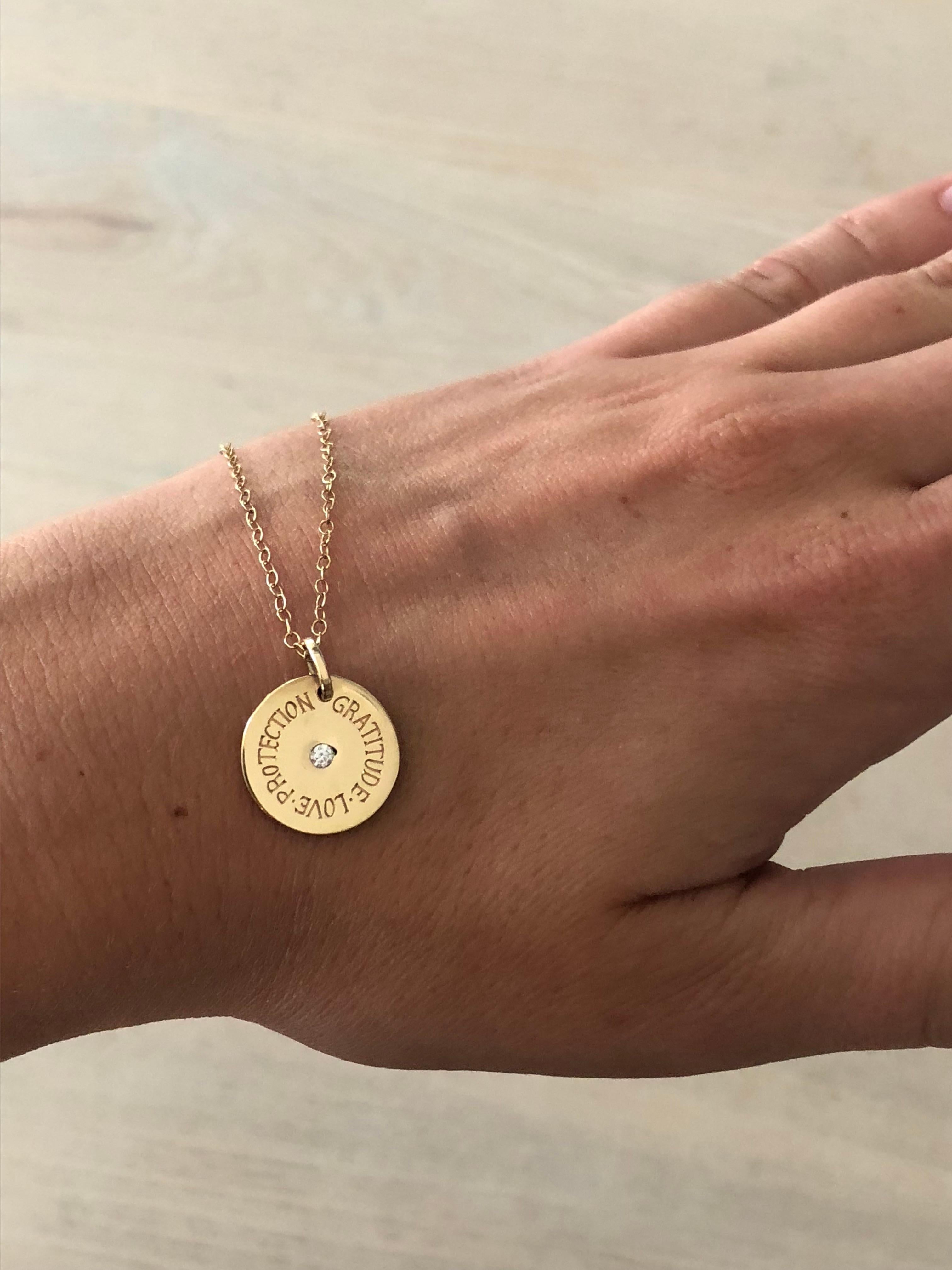 This 9 karat gold charm has powerful words hand engraved around the disc to protect its wearer. Gratitude, Love, Protection. To remind us to be grateful for all we have, to invite love and to attract protection at all times.

Options to personalize