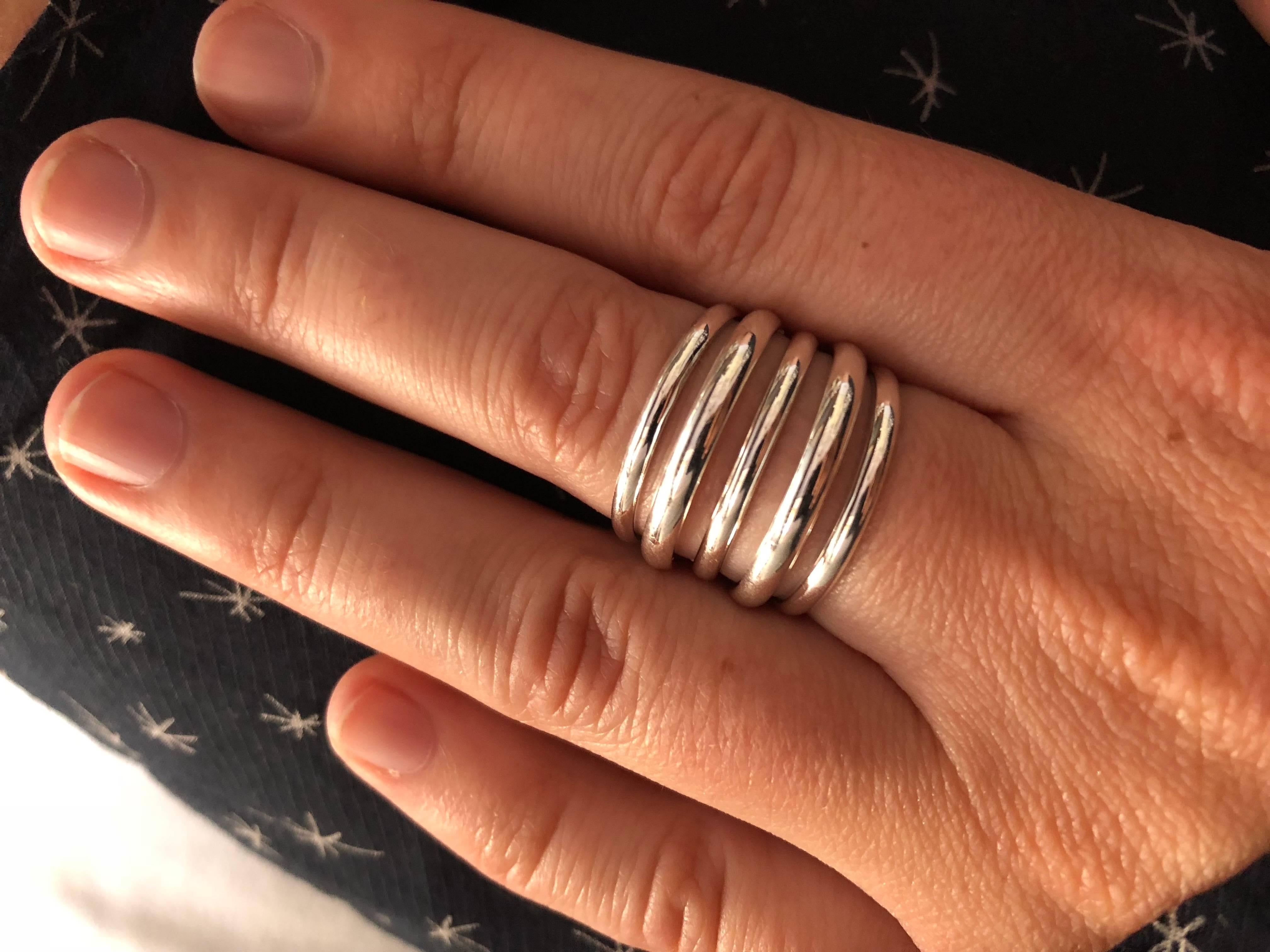 This 5 band 18 karat white gold Berlin ring is a stylish piece of jewellery for all occasions. It's modern and easily  wearable design is a nod to simplicity as the ultimate form of sophistication. Designed and handcrafted in the UK. 

- 18kt White