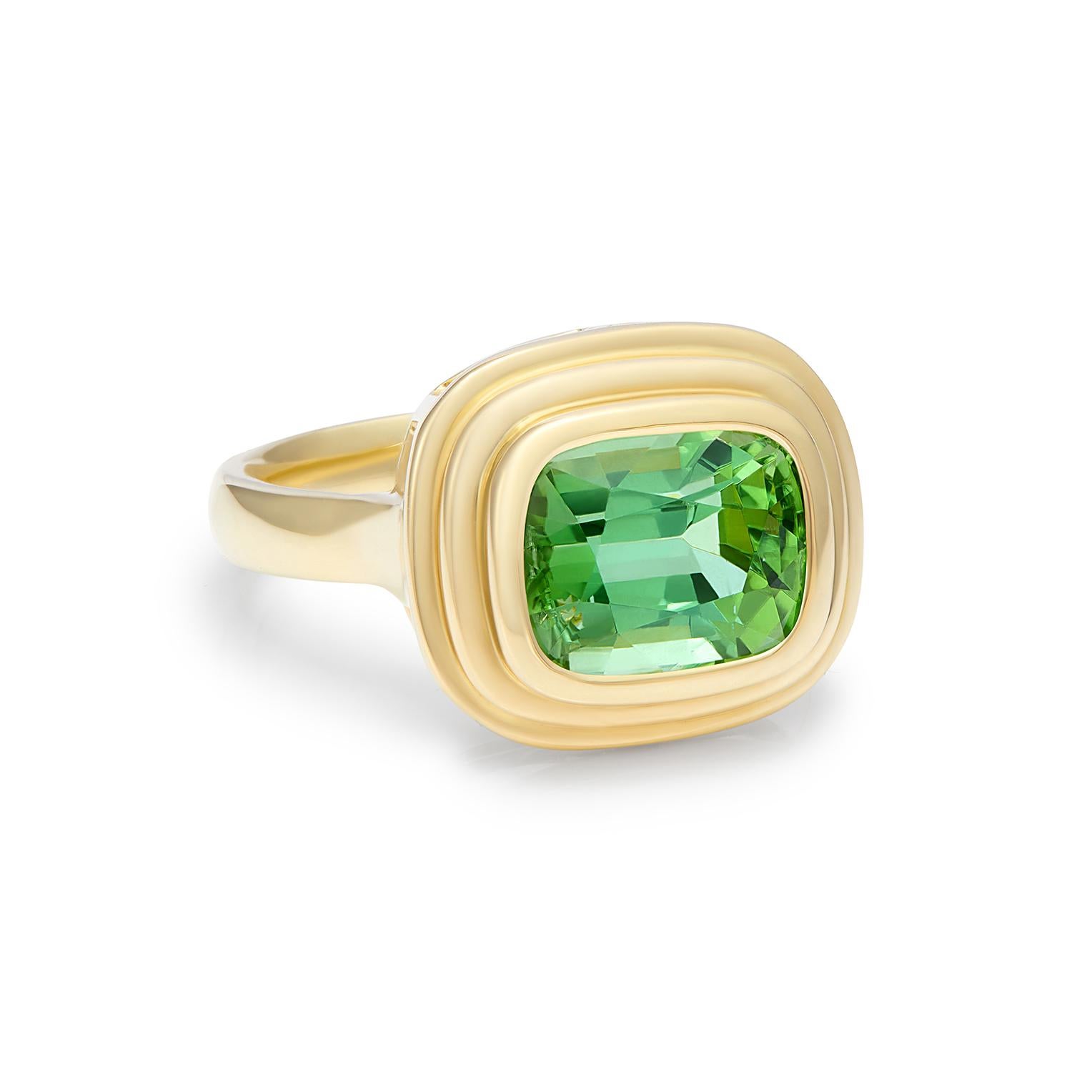 3.68 carat Green Tourmaline ring set in 18 karat yellow gold. This beautiful green Tourmaline is a vivid green colour in a wonderful statement size, forever changing in different lights. Each piece of this collection is unique due to the rarity of