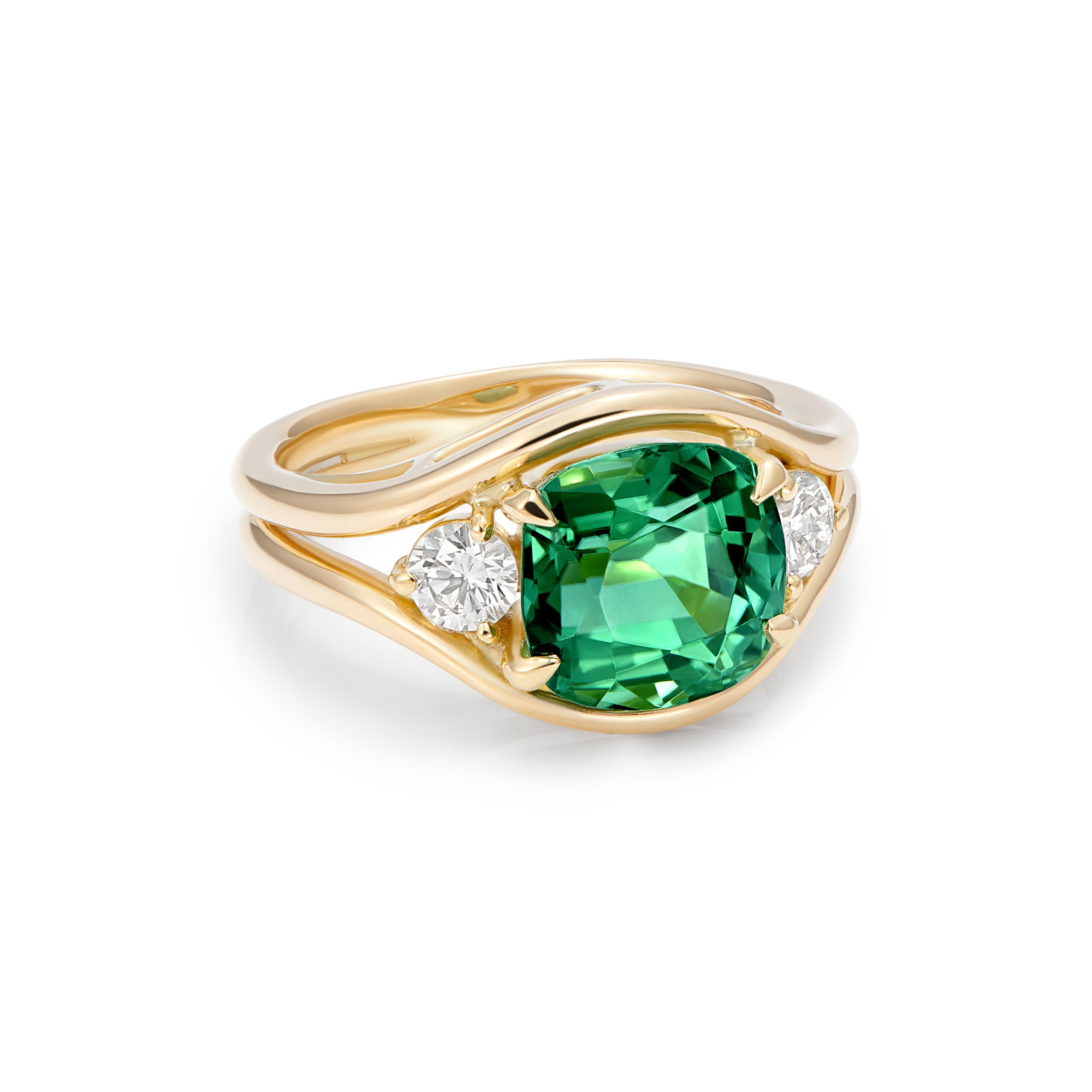 A Green Tourmaline cushion cut set with 2 round white diamonds. 
Mermaid ring, paying homage to the treasures of the sea, the Mermaid collection showcases beautiful pearls, diamonds and gorgeous ocean-coloured gemstones. This unique, one-of-a-kind