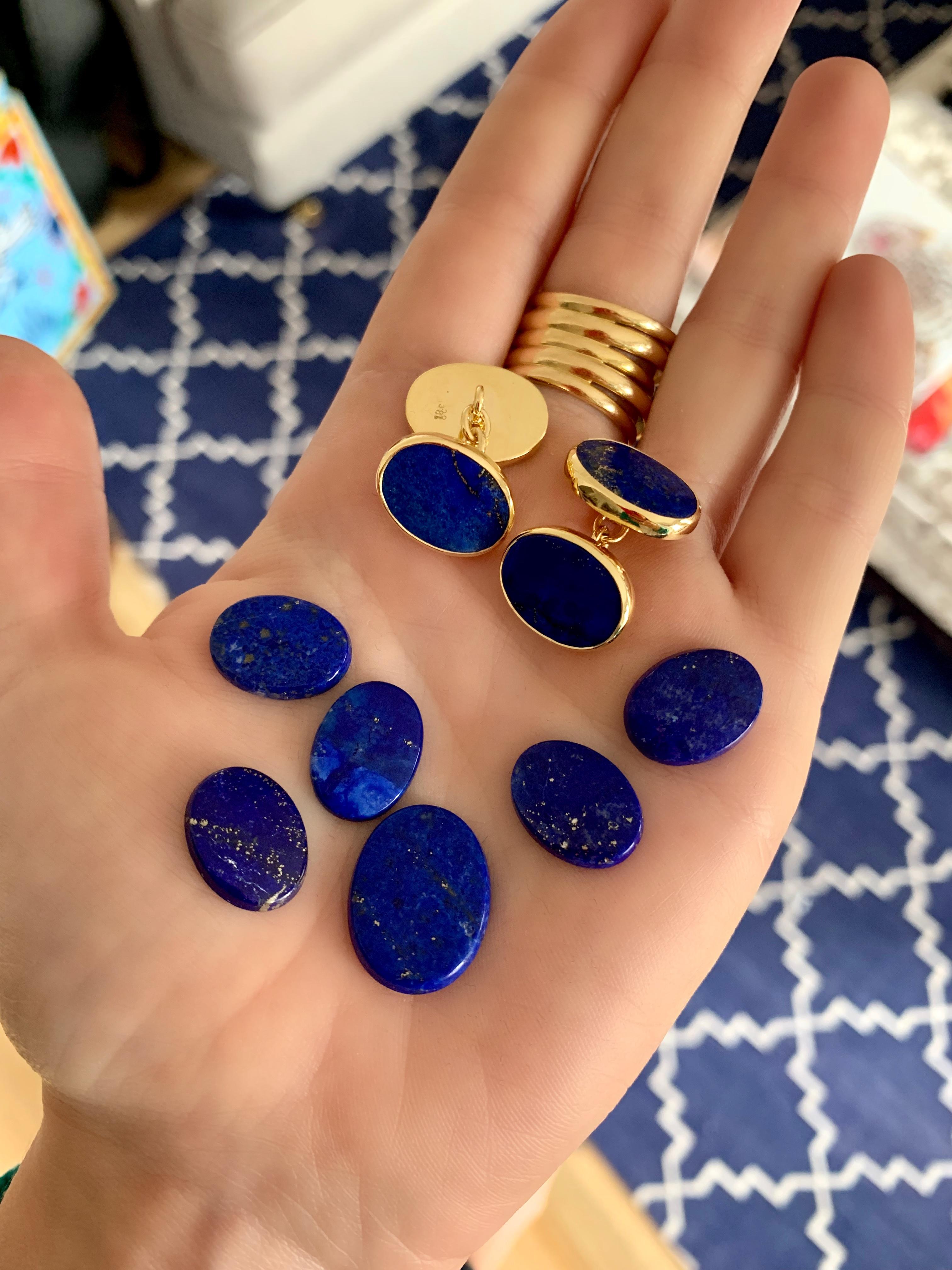 A pair of striking Lapis Lazuli cufflinks set in 18 karat yellow gold with gold chain links. Natural Lapis with natural inclusions creating a classic pair of very wearable cufflinks. Perfect for weddings, Christmas, Fathers Day and many other