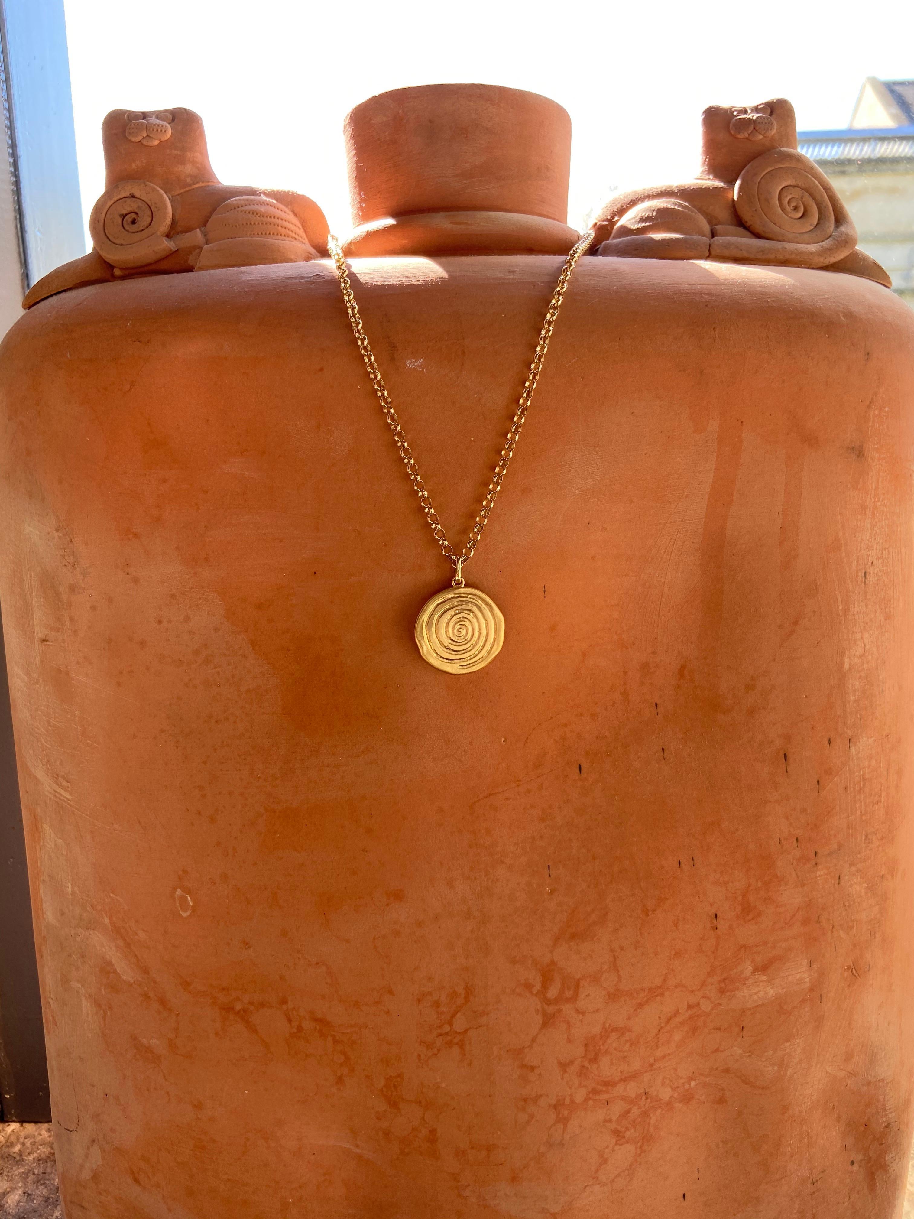 Infinity spiral necklace, hand engraved with the symbol of infinity and life. The infinity symbol holds a deep meaning in spirituality: Love, beauty and power. It represents simplicity and balance in a world filled with complications and