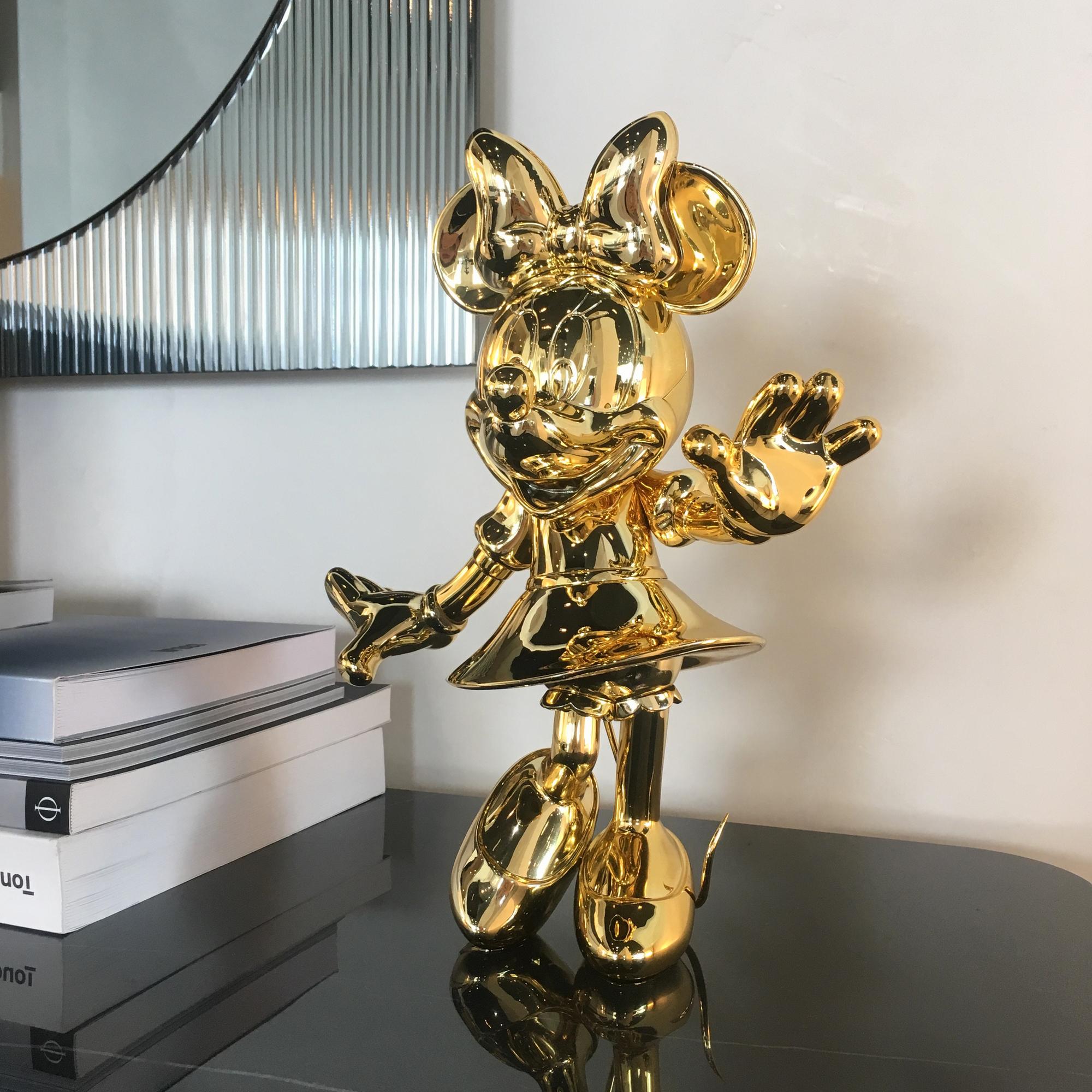 gold minnie mouse statue