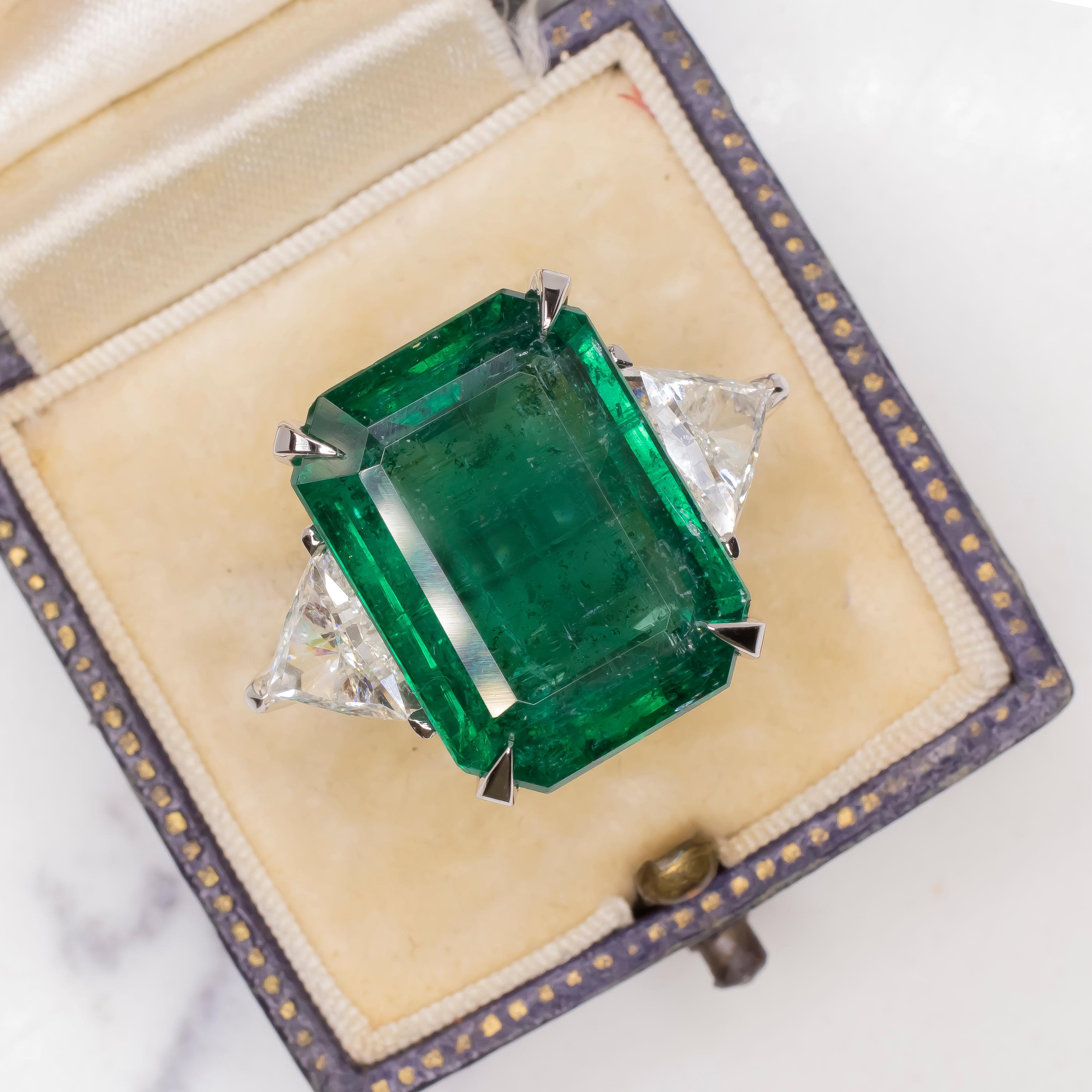 Elevate your style with this extraordinary ring, meticulously crafted in Italy and featuring a 16 carat emerald cut emerald, certified by GIA as minor oil. The mesmerizing green hue of the emerald, cut in an elegant emerald shape, is a true