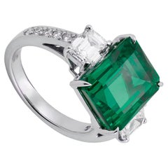 MINOR OIL GRS Certified vivid green  6.89 Carat Emerald Cut Diamond Ring