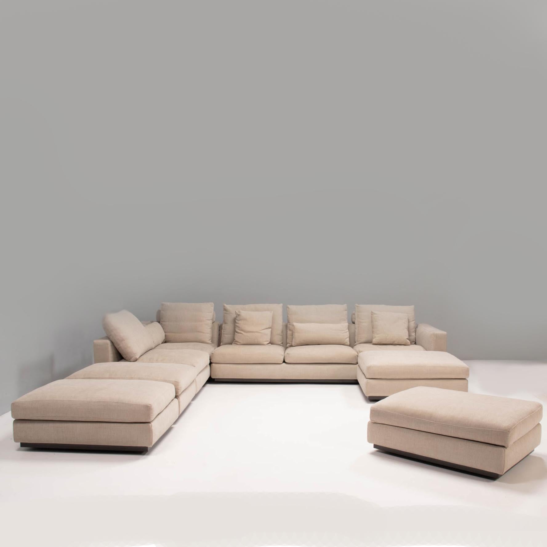 Designed by Rodolfo Dordoni for Minotti, the Andersen Line sofa formed part of the 2010 Senza Tempo Collection and embodies timeless Italian design.

Fully upholstered in beige fabric, the sofa has a modern linear silhouette sitting on a metal