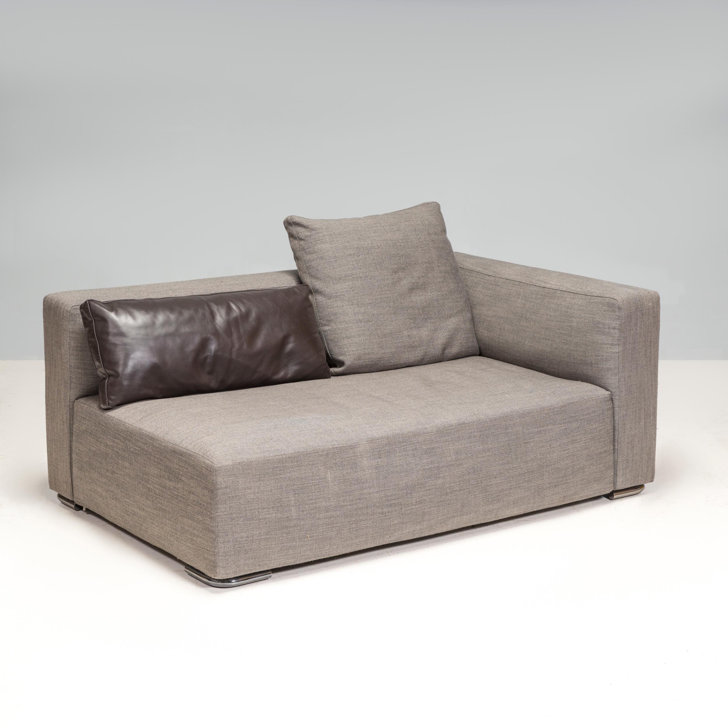 Designed by Rodolfo Dordoni for Minotti, the Donovan sofa embodies timeless Italian design. A one-piece seating system made up of a grouping of slender shapes that reveal a surprising softness.

Fully upholstered in grey fabric, the sofa has a