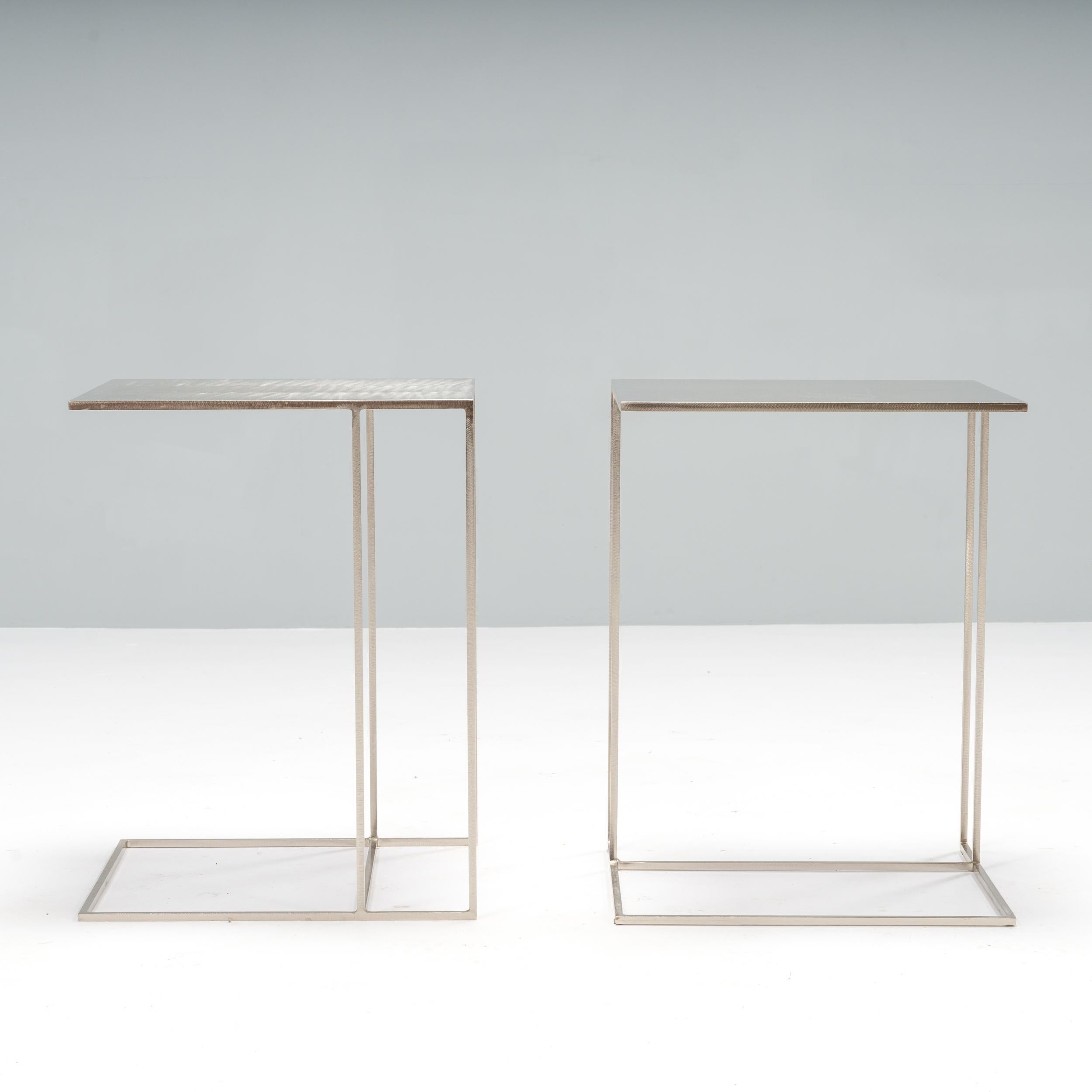 Designed by Rodolfo Dordoni for Minotti, the Leger side table formed part of the 1998 Collection which celebrated simple, elegant shapes and linear style.

Constructed from brushed steel, these two side tables have a sleek silhouette.

The