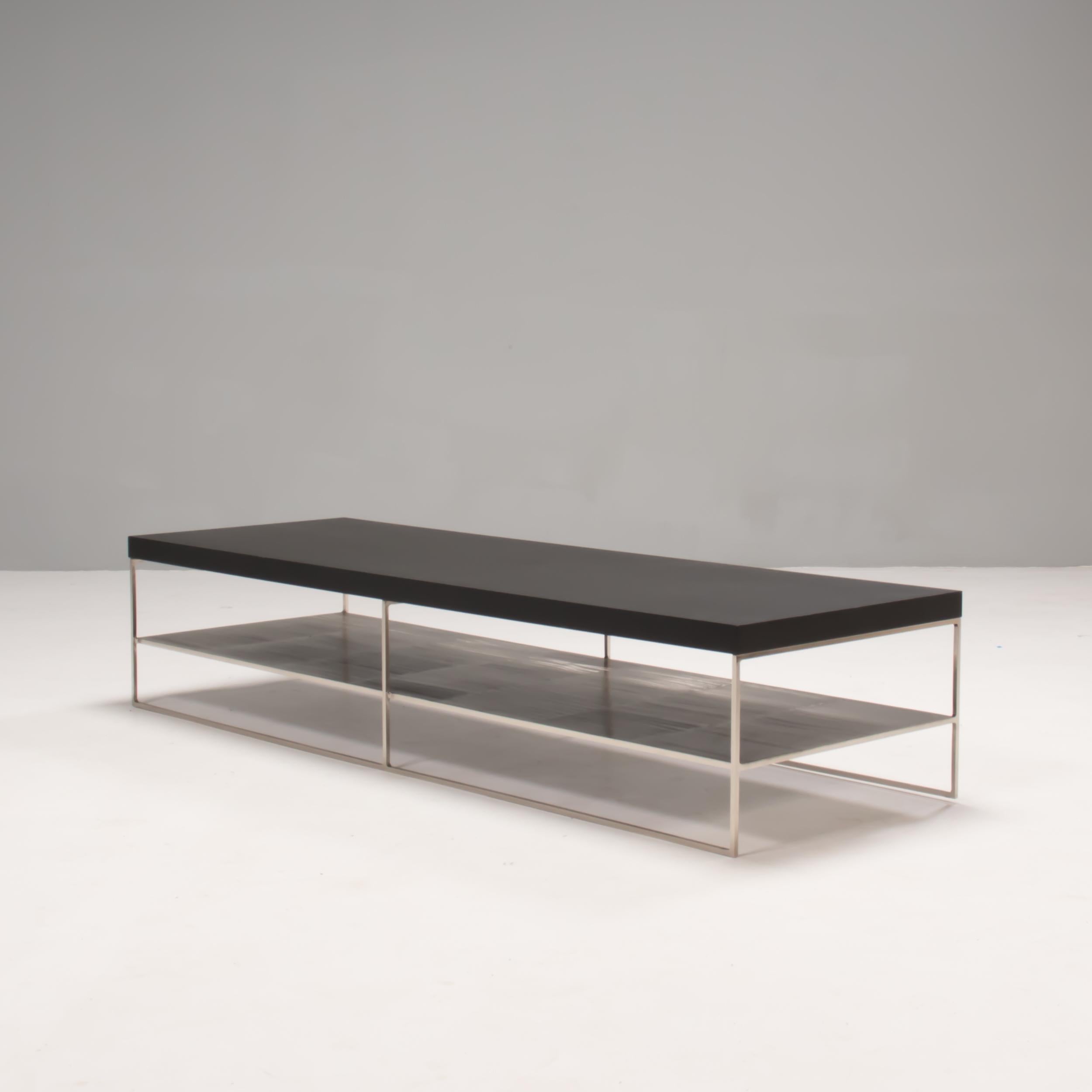 Designed by Rodolfo Dordoni for Minotti, the Liam coffee table formed part of the 2020 Collection which embodies contemporary Italian design.

Constructed from a 1cm square steel frame with a pewter finish, the coffee table has a slimline