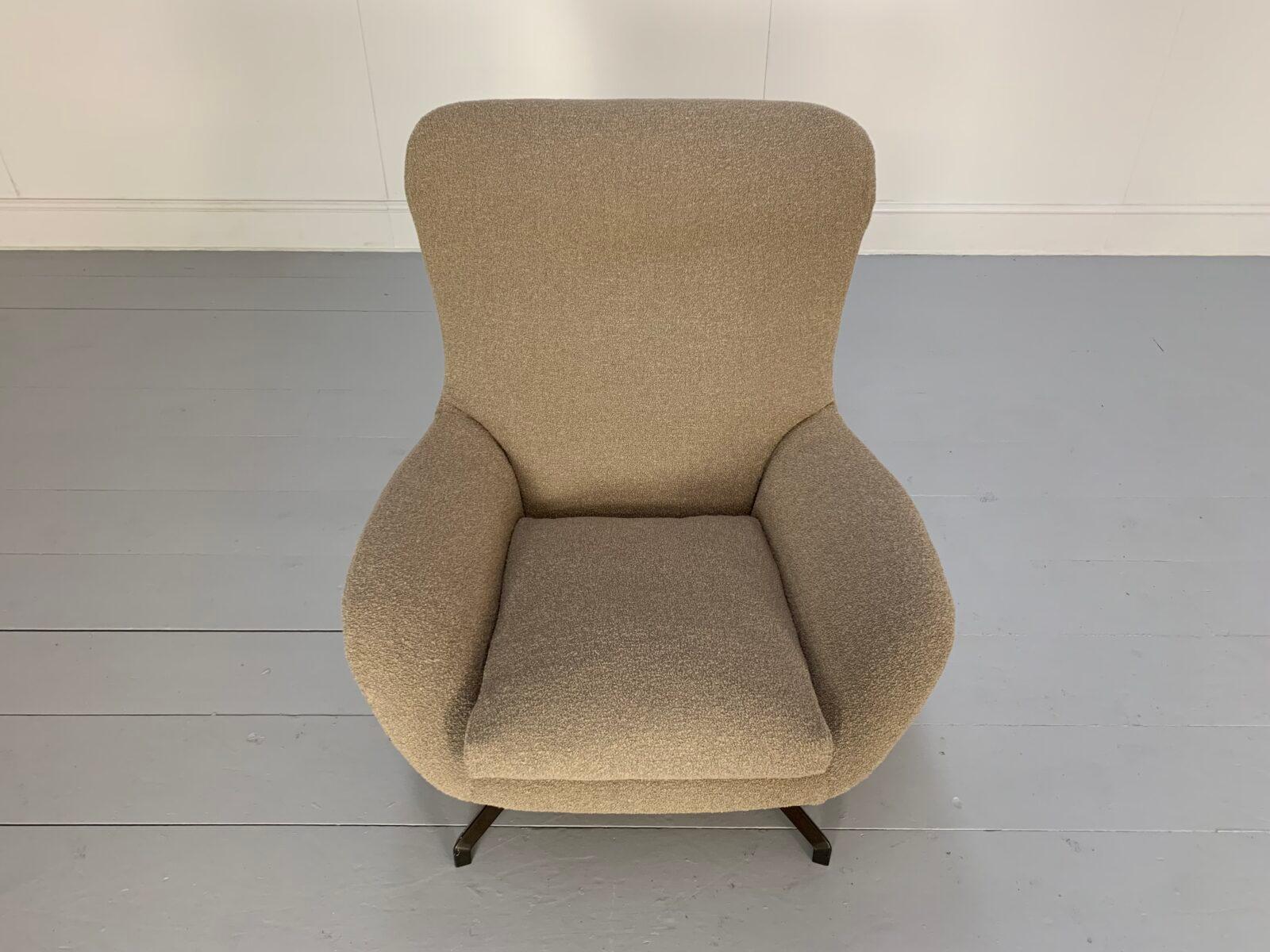 On offer on this occasion is a rare, sublime Minotti “Jensen” High-Back armchair, dressed in a peerless, top-grade woollen-boucle fabric, and with gloss pewter-metal star-shaped swivel-base.

As you will no doubt be aware by your interest in this