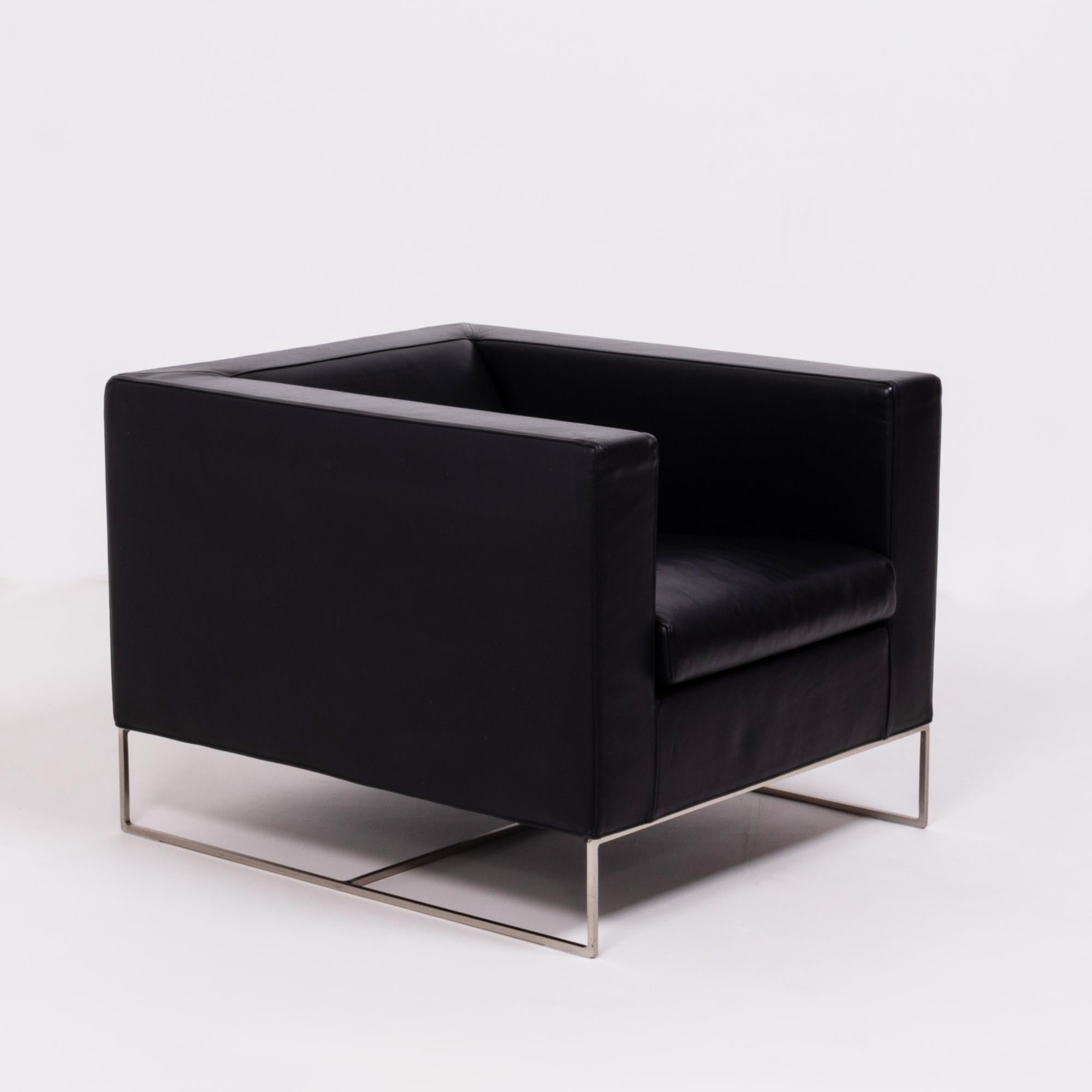 Designed by Rodolfo Dordoni for Minotti, the klee armchair has a sleek, modern silhouette.

The chair has a bold cube-like shape, contrasted by a finer, geometric base constructed from hand worked metal.

Fully upholstered in black leather, the