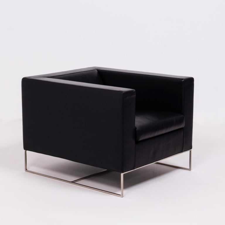 Designed by Rodolfo Dordoni for Minotti, the klee armchair has a sleek, modern silhouette.

The chair has a bold cube-like shape, contrasted by a finer, geometric base constructed from hand worked metal.

Fully upholstered in black leather, the