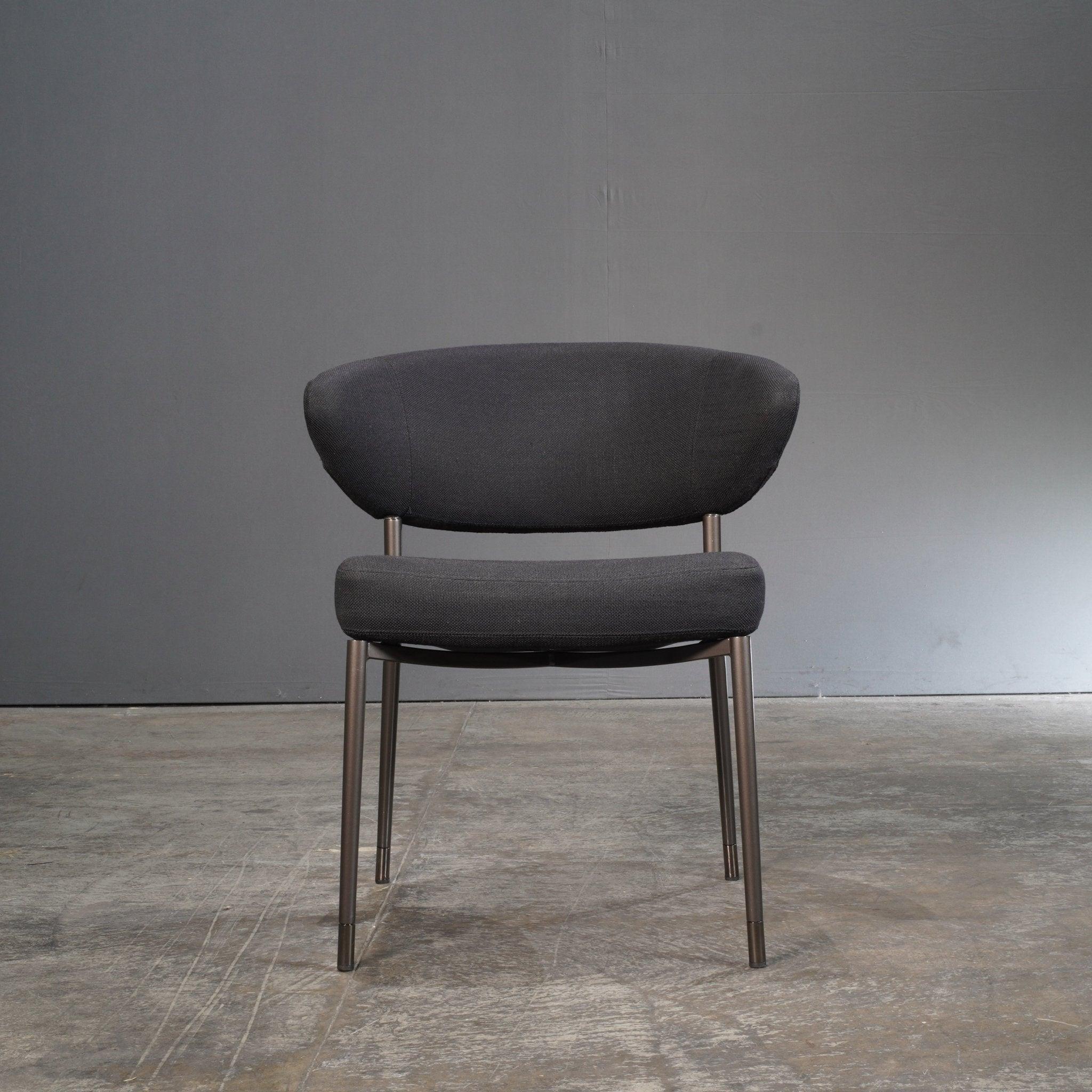 Introduce a touch of elegance and sophistication to your dining space with the Mills Dining Chair by renowned designer Rodolfo Dordoni for Minotti. Crafted with the highest quality materials, this chair features a sleek and modern design that will