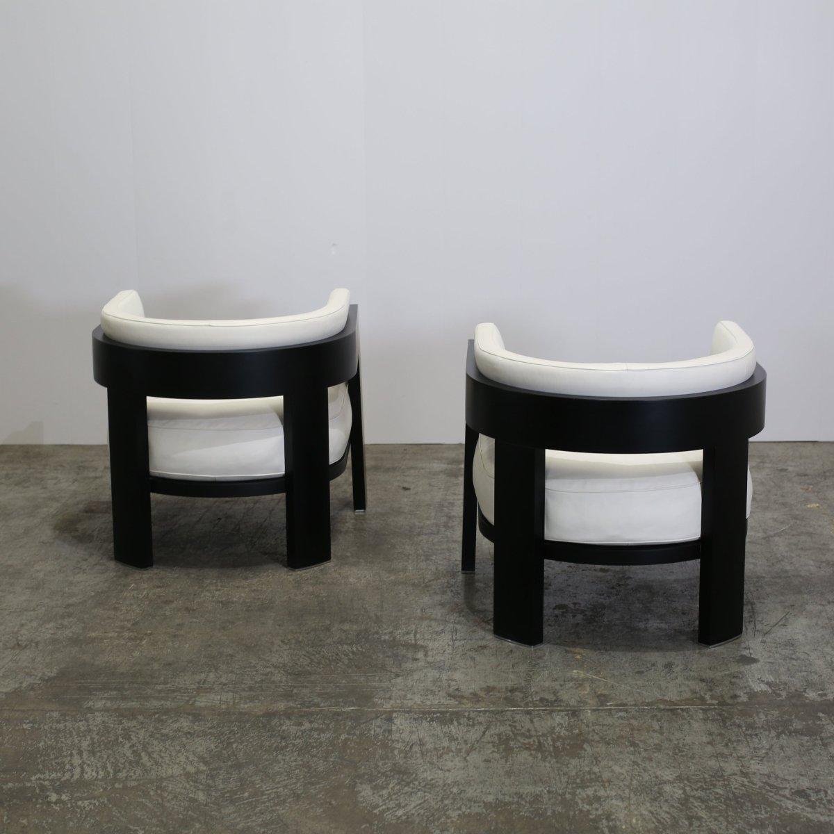 Introducing the Warhol Blac Lac Armchair by Minotti, a stunning piece that exudes sophistication and style. Crafted with the highest quality materials, this armchair features a sleek black lacquered frame that adds a touch of modern elegance to any