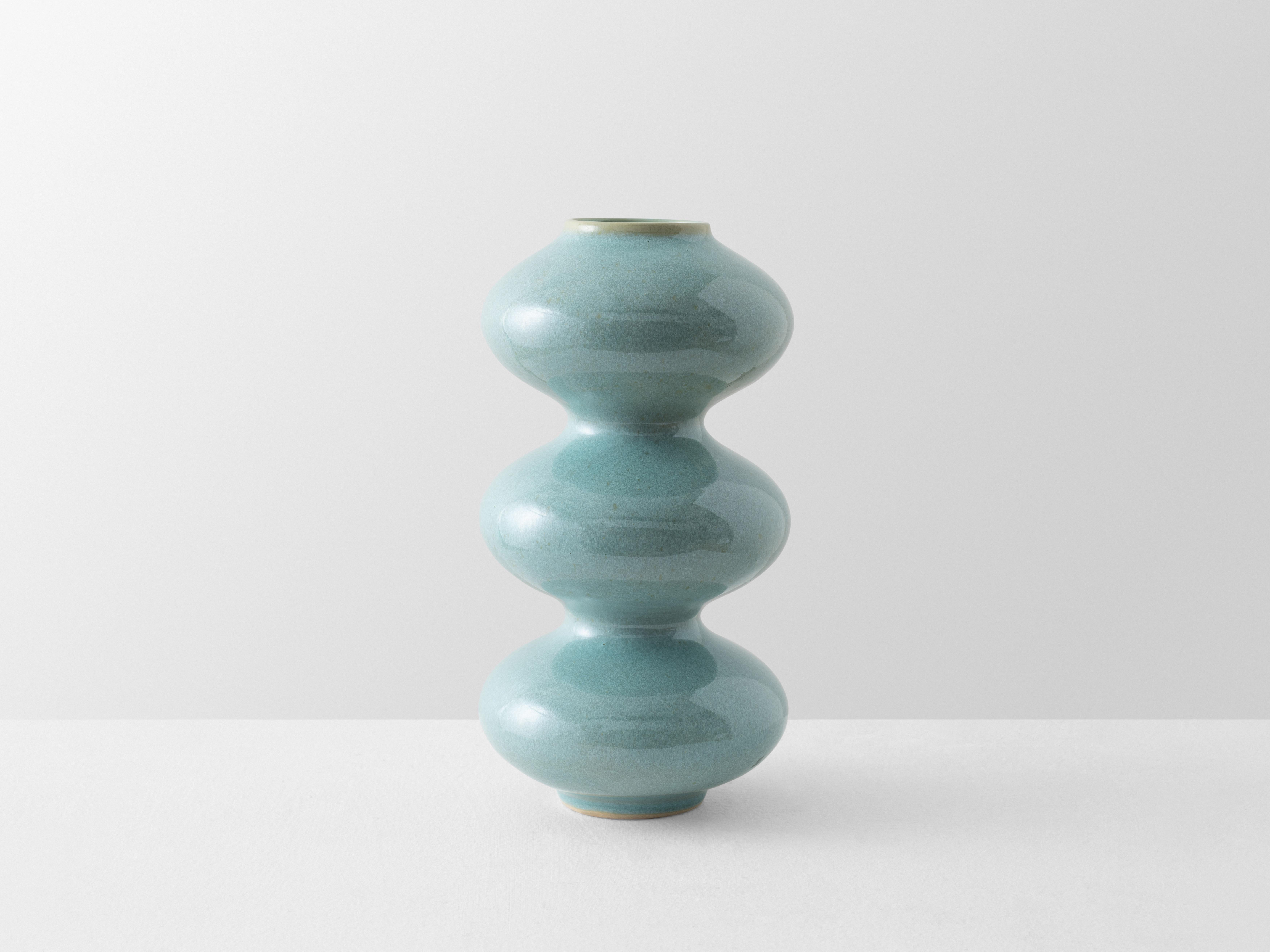 Mint Blue Wave Form Vase by Forma Rosa Studio
Dimensions: D 14 x W 14 x H 28 cm.
Materials: Ceramic.

Available in Crystal Cream, Mint Blue, and Oxblood colors.

Our Wave Form Vase is our classic timeless design, developed with digital precision and