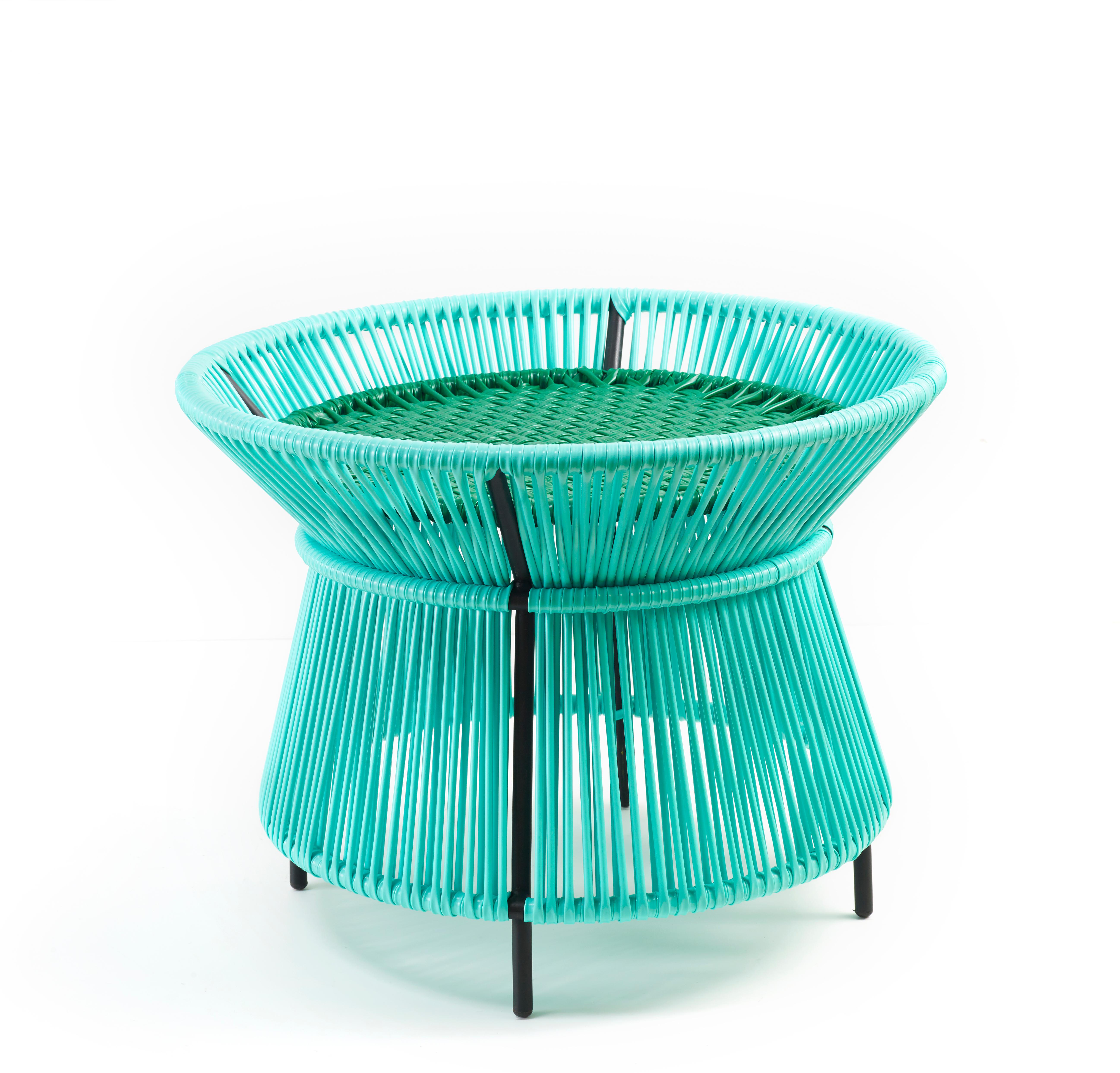 Mint caribe basket table by Sebastian Herkner
Materials: Galvanized and powder-coated tubular steel. PVC strings are made from recycled plastic.
Technique: Made from recycled plastic and weaved by local craftspeople in Colombia. 
Dimensions: