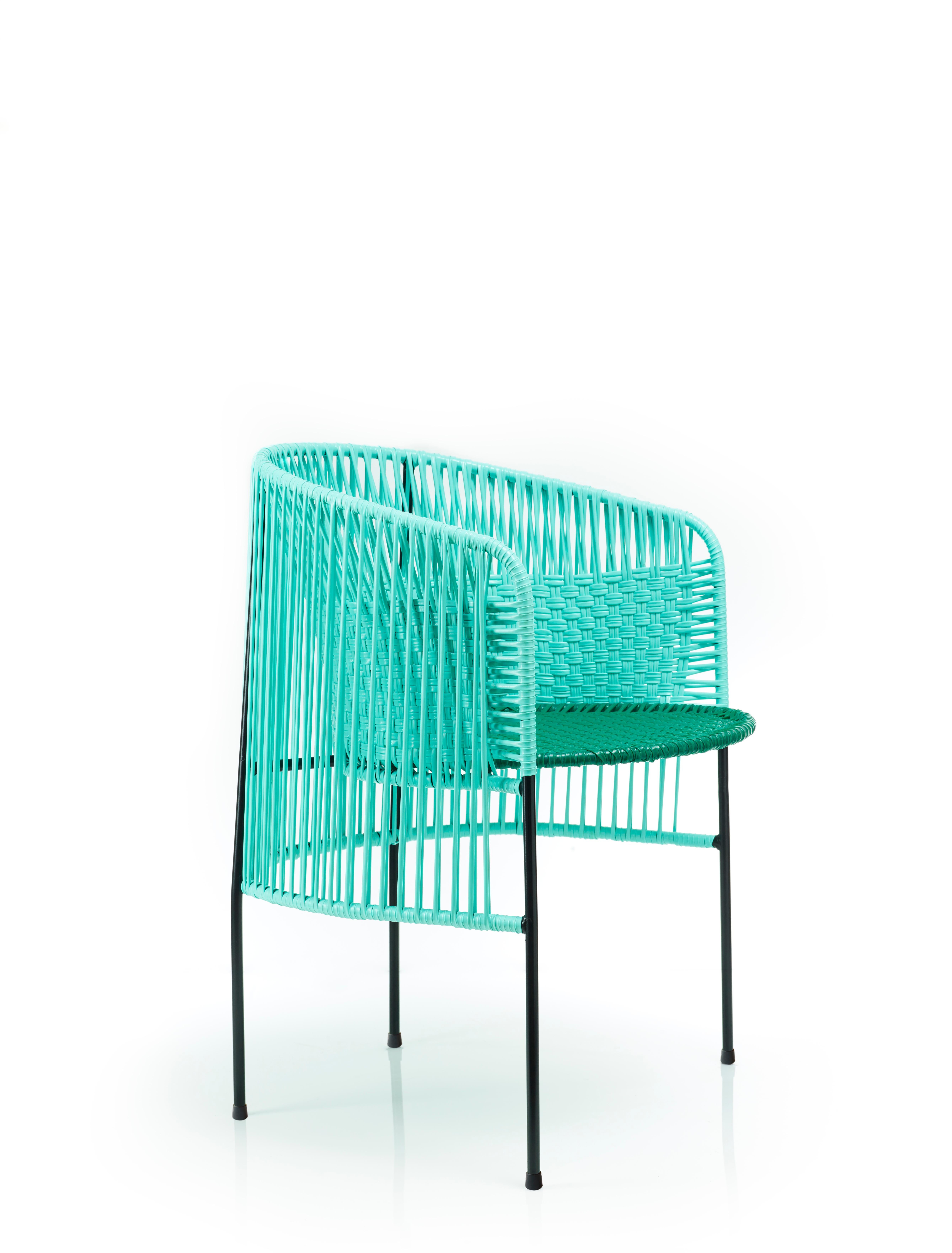 Mint caribe dining chair by Sebastian Herkner
Materials: Galvanized and powder-coated tubular steel. PVC strings are made from recycled plastic.
Technique: Made from recycled plastic and weaved by local craftspeople in Colombia. 
Dimensions: W