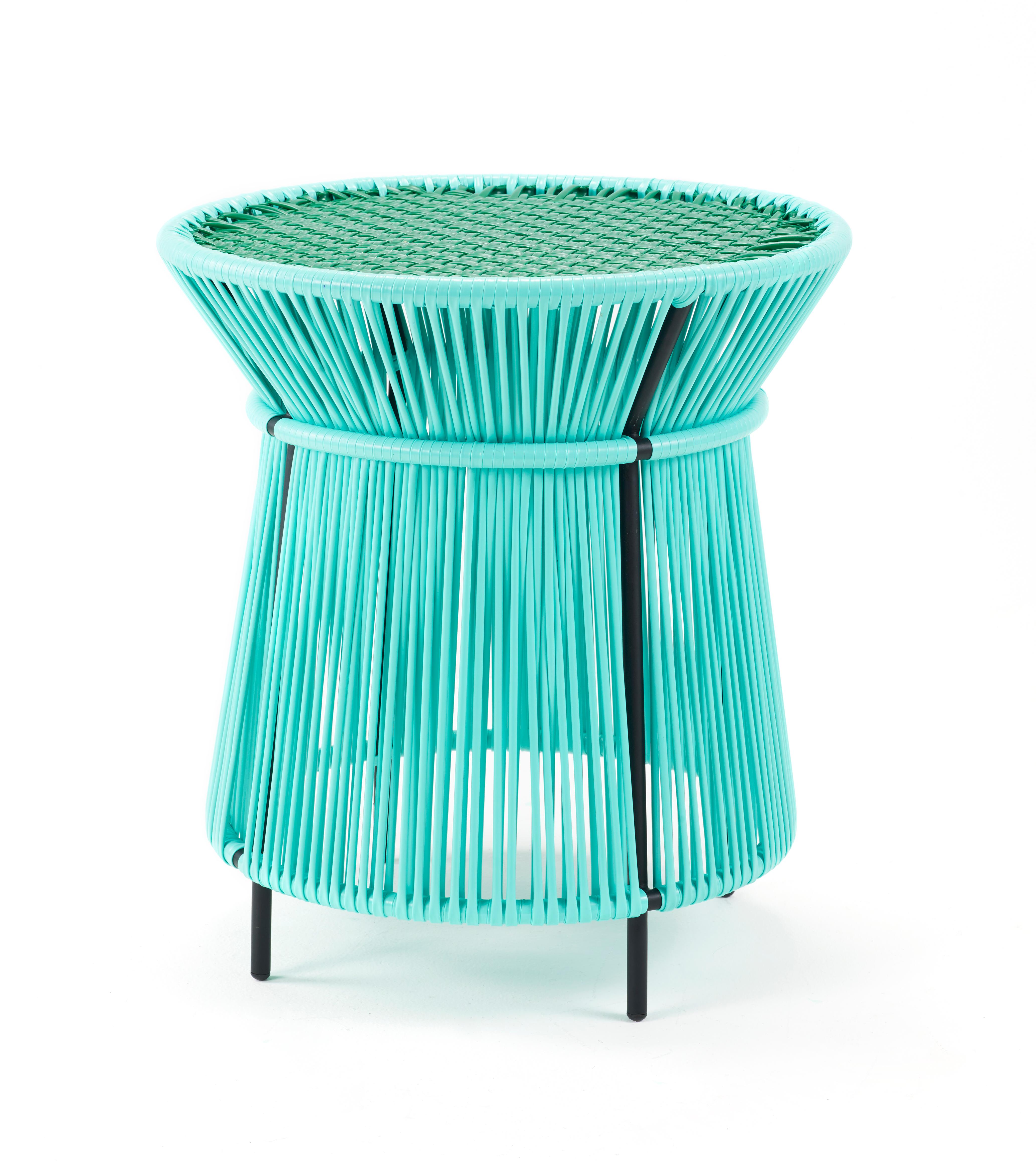 Mint caribe high table by Sebastian Herkner
Materials: Galvanized and powder-coated tubular steel. PVC strings are made from recycled plastic.
Technique: Made from recycled plastic and weaved by local craftspeople in Colombia. 
Dimensions: