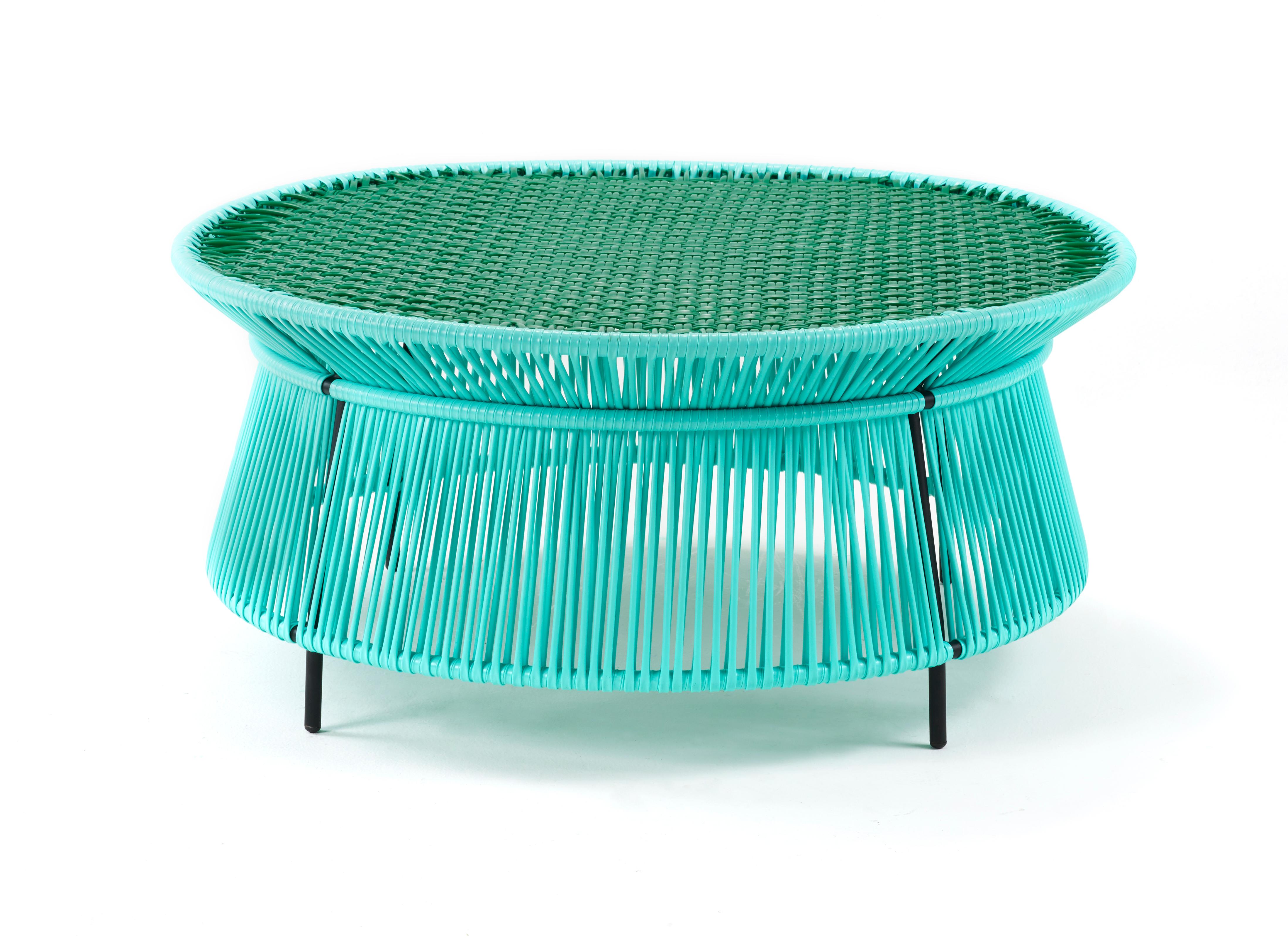 Mint Caribe low table by Sebastian Herkner
Materials: Galvanized and powder-coated tubular steel. PVC strings are made from recycled plastic.
Technique: Made from recycled plastic and weaved by local craftspeople in Colombia. 
Dimensions: