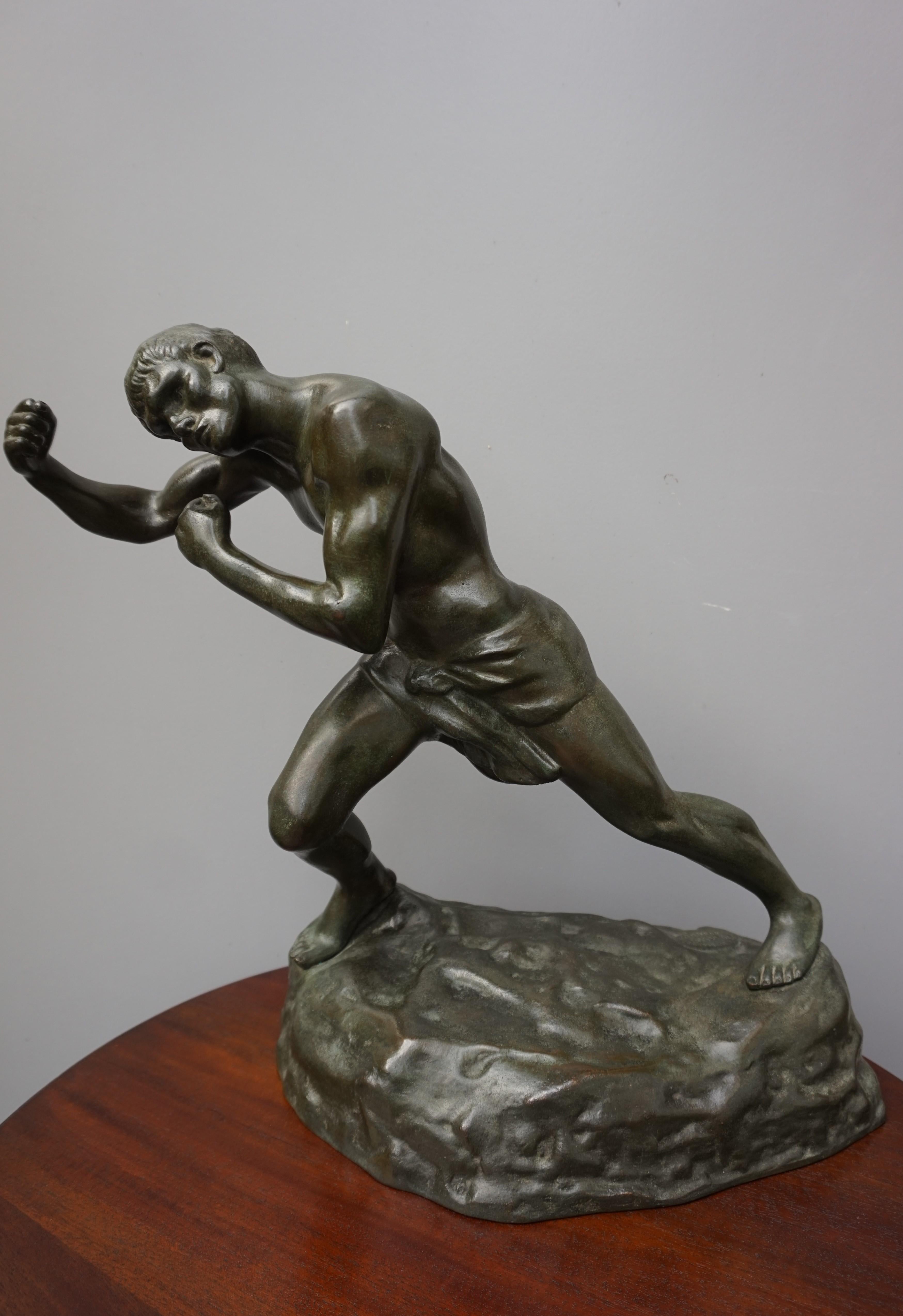 Powerful bronze sculpture of an athletic and ripped fighter.

This sizable and heavy work of art is as beautiful as the day it was handcrafted. Belgian sculptor Jef Lambeaux (1852-1908) had a penchant for capturing the human physique in motion, with