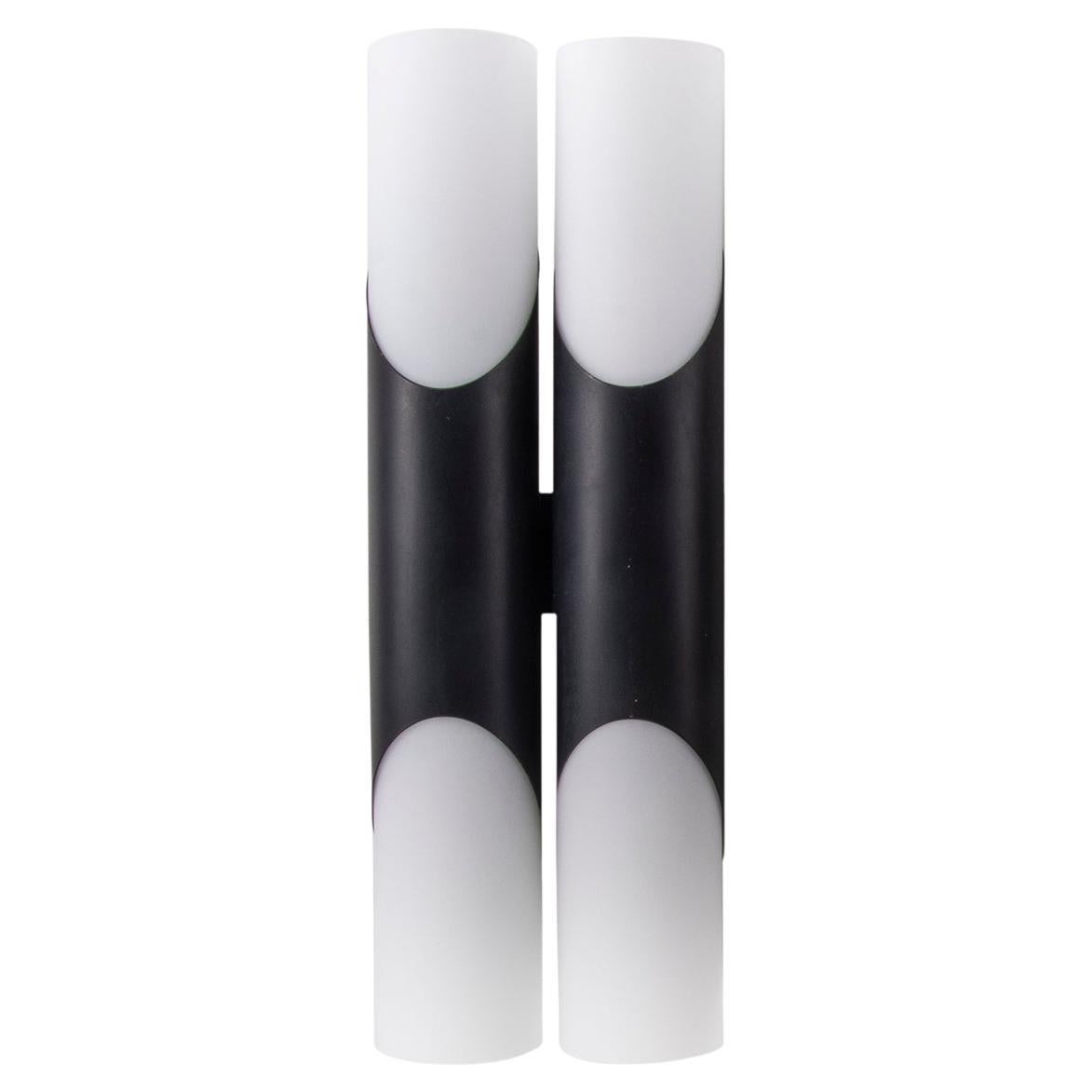 Single modernist double wall sconce with white opal glass diffusers on a tubular black brass frame in the unused condition and original packaging. Manufactured by Neuhaus Lighting, Germany in the 1970s. 

Design: Rolf Kruger. 
Manufacturer: Paul