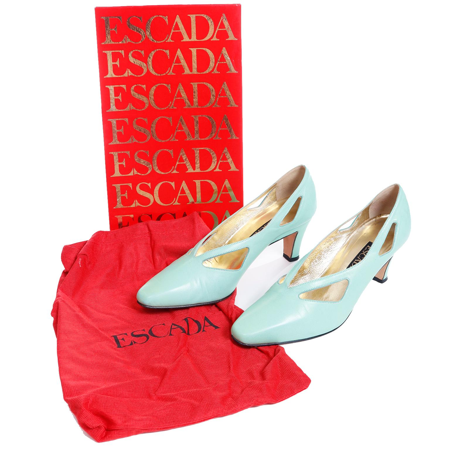 These fun Escada vintage 1980's shoes have unique cutouts and are in a soft mint green kid leather. The shoes are marked a size 7B and come with their original box and dust bag. The interiors are a beautiful gold lame and these were made in Italy in