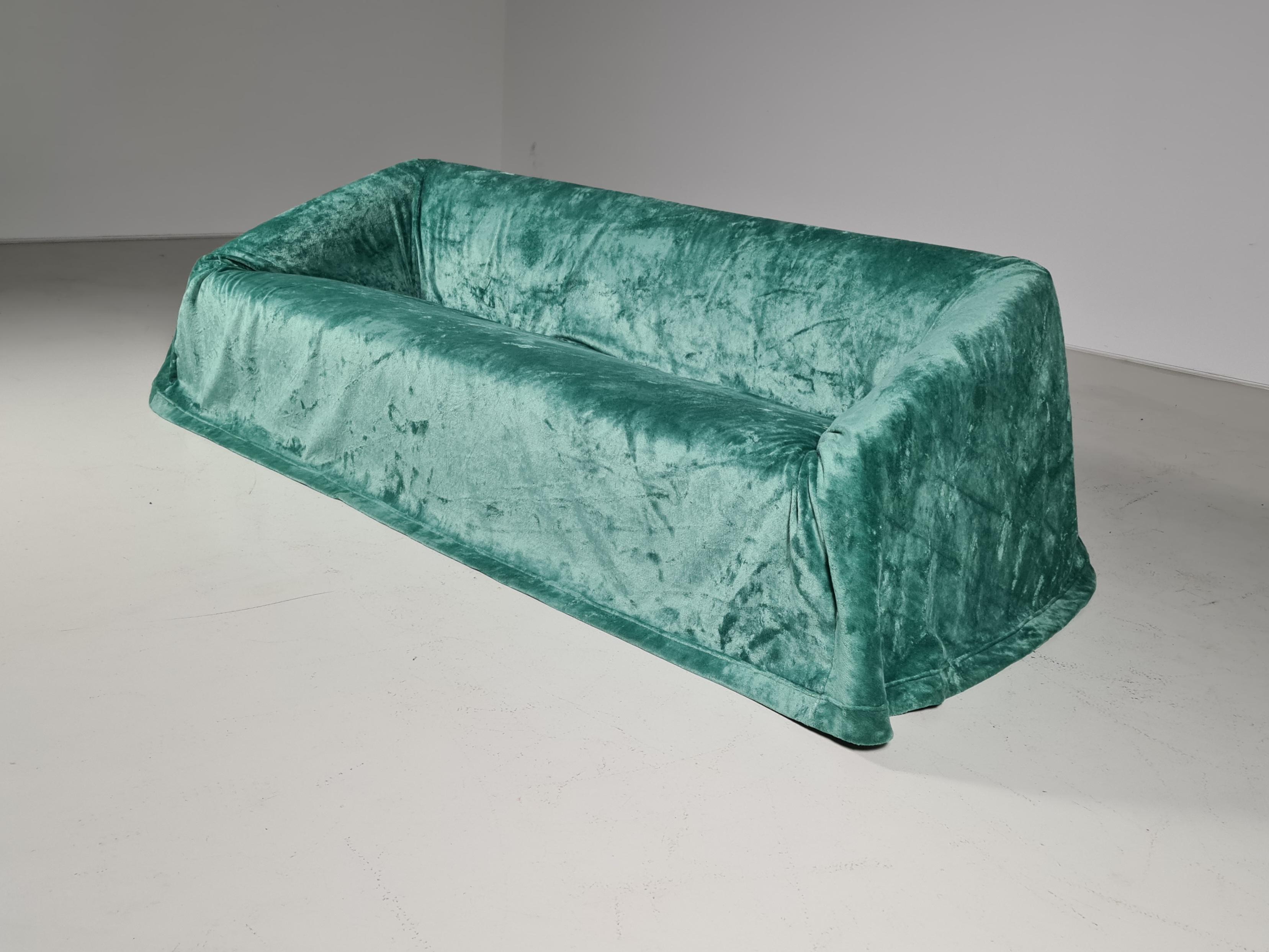 Mantilla sofa by Kazuhide Takahama for Simon Gavina. The Mantilla's name comes from the mantle which covers it. The idea comes from the memory of protecting the furniture of holiday mansions by covering them with fabrics during the winter months.