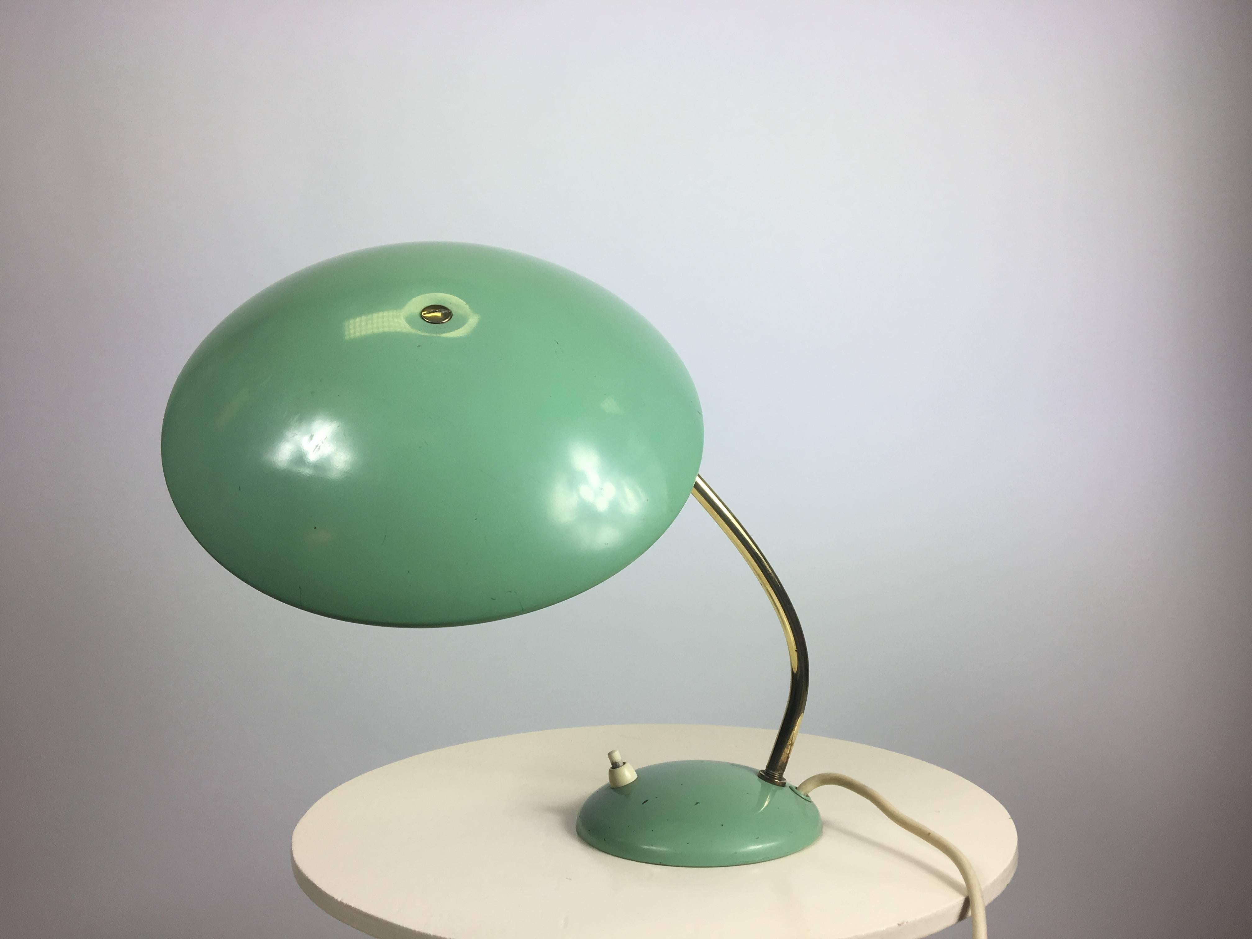 Petite-sized Philips desk lamp in mint green. 1950s  produced by Philips Eindhoven.
The hood is hinged so it can turn .