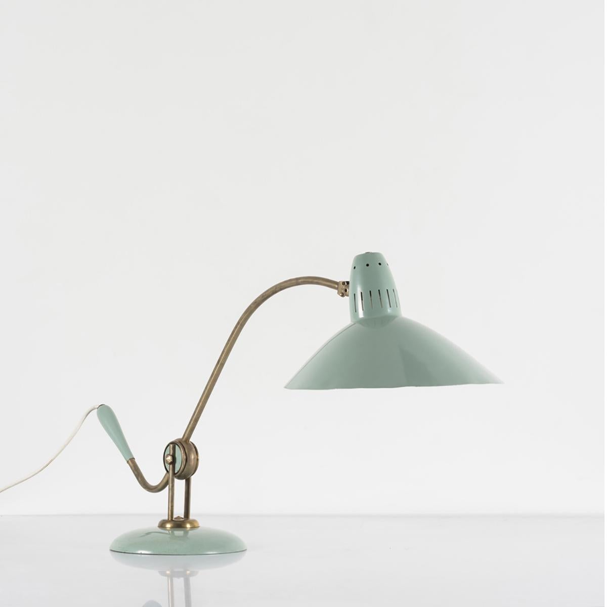 Mint green sculptural desk lamp, enamelled metal, wood and brass, France, 1950's

This desk lamp is as elegant as it is functional. It's unusual color, graceful lines and masterful proportions are remarkable and unusual. Skillfully made and deftly