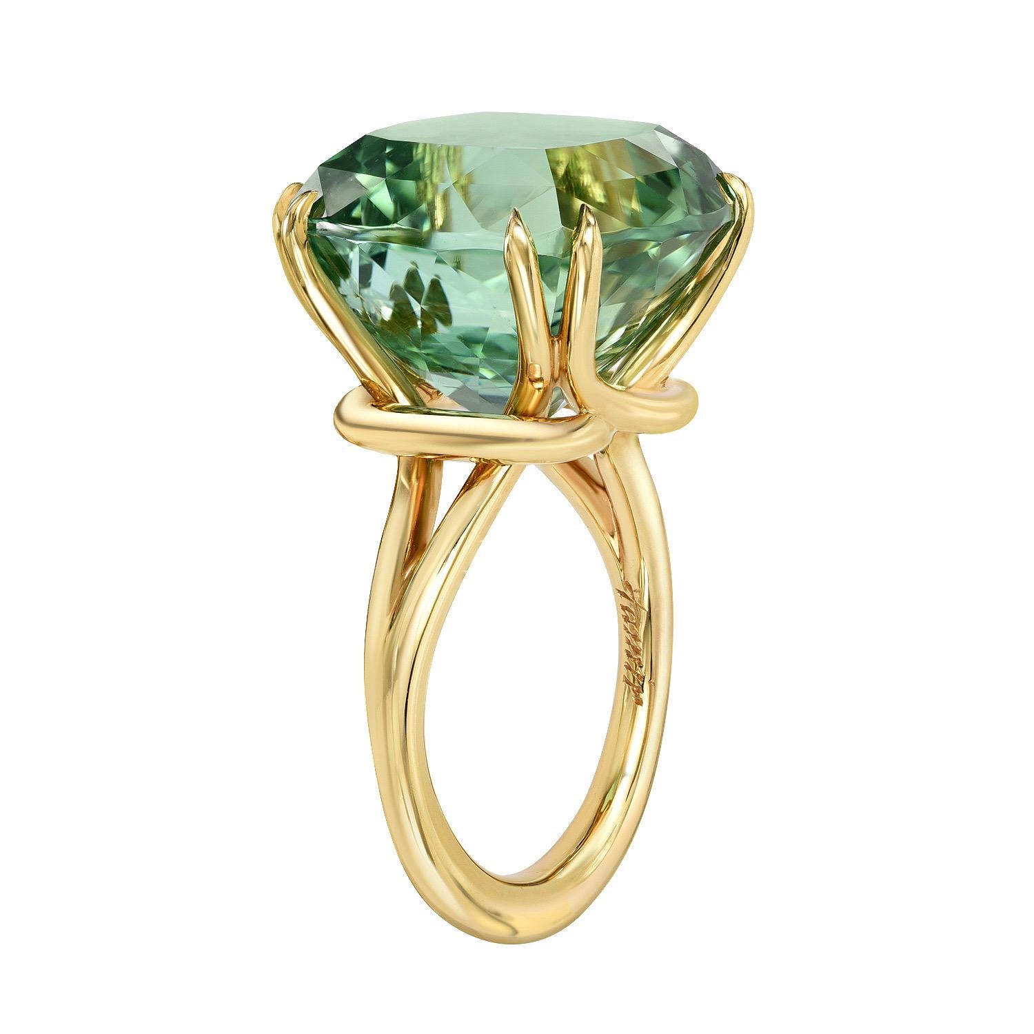 Incredible 18.04 carat cushion-cut Mint Green Tourmaline, showcased in a hand crafted 18K yellow gold ring.
Size 6. Re-sizing is complimentary upon request.
Returns are accepted and paid by us within 7 days of delivery.
Crafted by extremely skilled