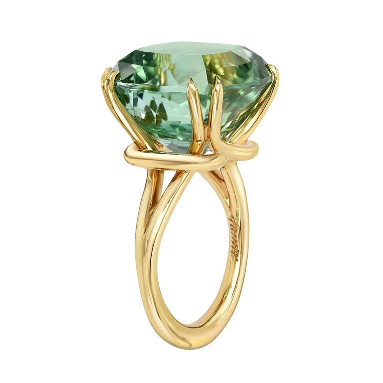 Exceptional 18.04 carat cushion-cut Mint Green Tourmaline, showcased in a hand crafted 18K yellow gold ring.
Size 6. Re-sizing is complimentary upon request. 
Returns are accepted and paid by us within 7 days of delivery.