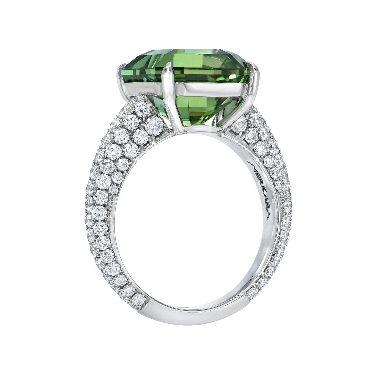 Notable 7.10 carat Mint Green Tourmaline emerald-cut, platinum ring, decorated by a total of 1.34 carat, round brilliant, collection diamonds.
Ring size 6. Resizing is complementary upon request.
Crafted by extremely skilled hands in the