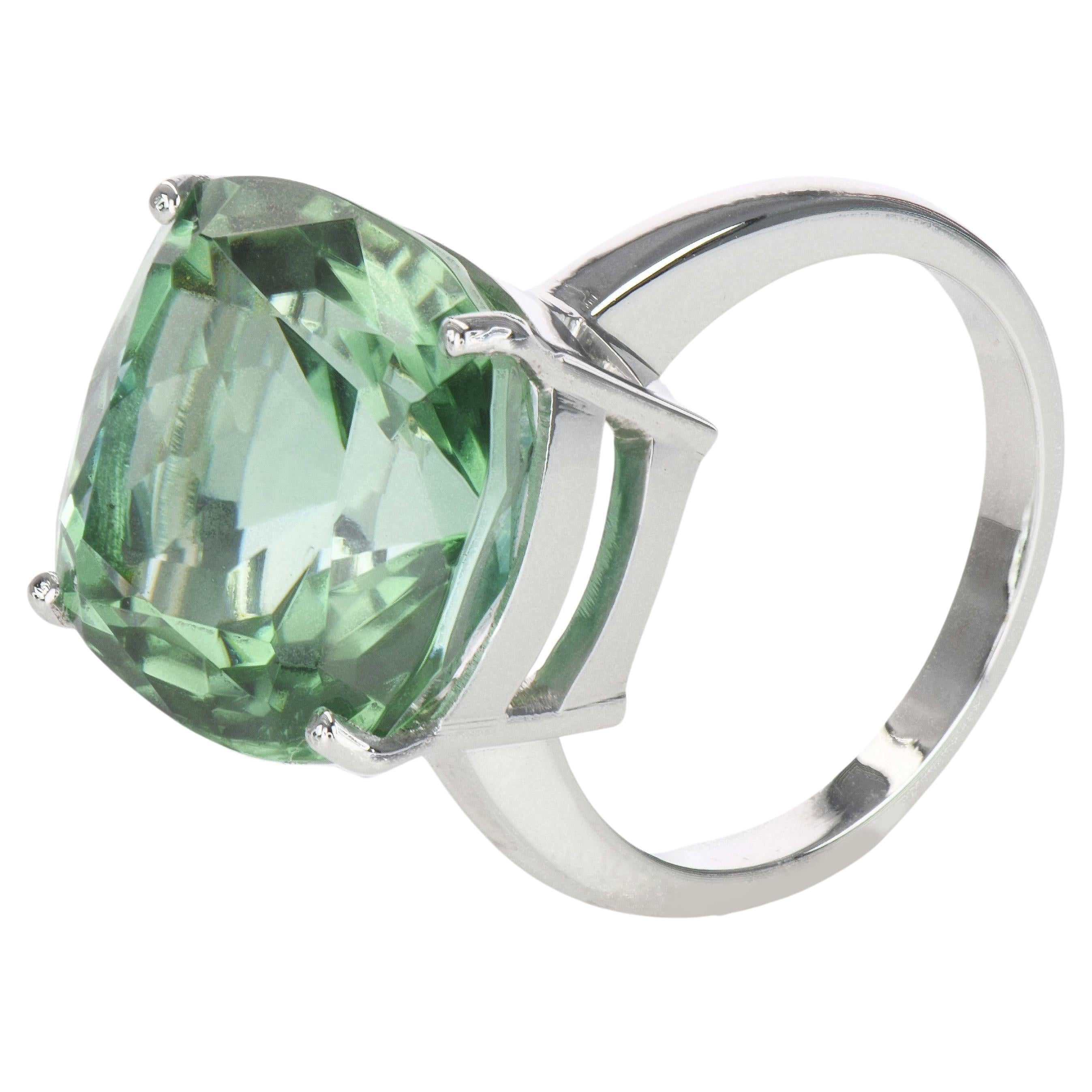 Mint Green Tourmaline Solitaire Ring

Creator: Carson Gray Jewels	
Ring Size: 6.5
Metal: 18KT White Gold
Stone: Mint Green Tourmaline
Stone Cut: Cushion; Modified Brilliant
Weight: 14.06 carats
Style: Statement Ring
Place of Origin: Congo
Period:
