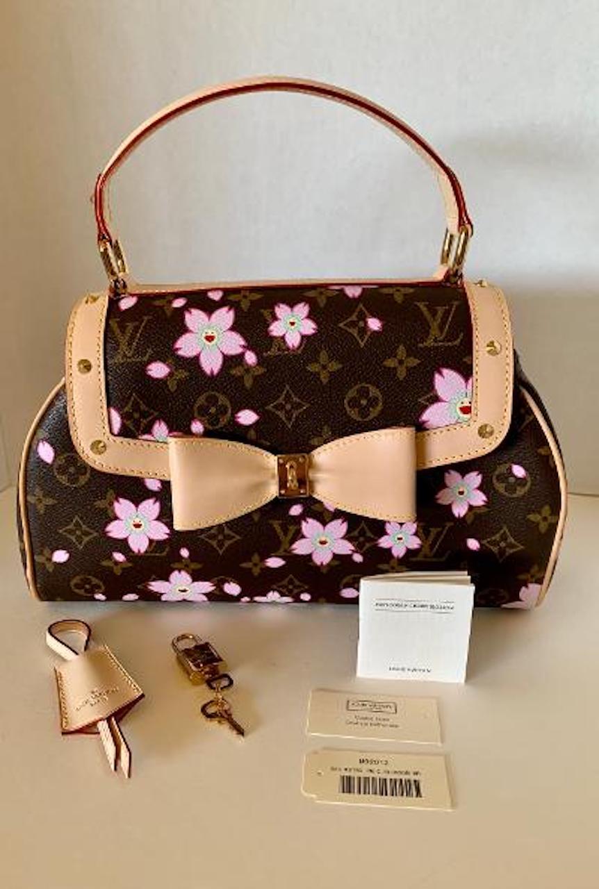 Rare and very collectible, retro Louis Vuitton, limited edition Cherry Blossom purse or satchel or handbag from the Spring/Summer 2003 Takashi Murakami Collection is a timeless and feminine bag that Louis Vuitton lovers everywhere want to collect.