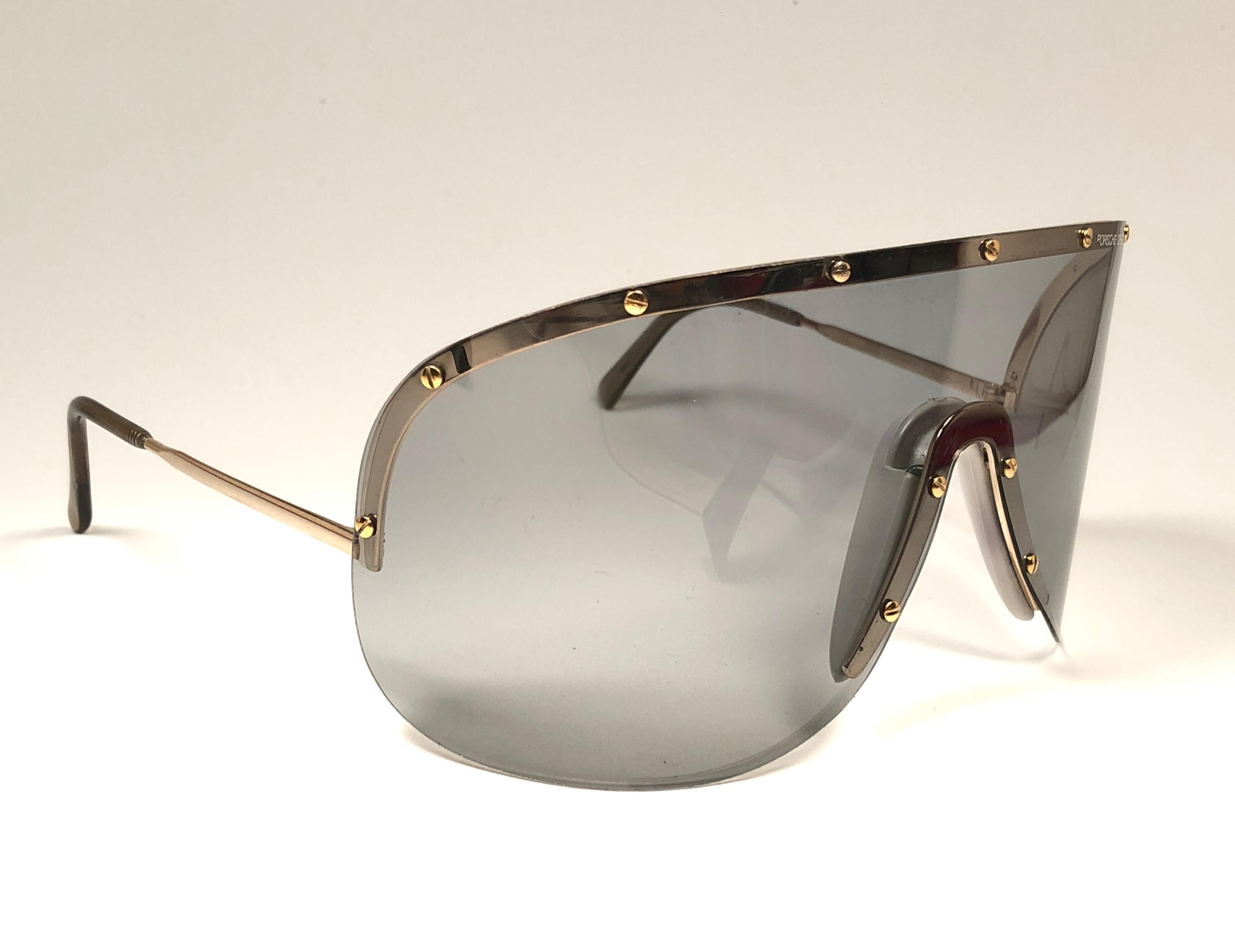 Ultra rare collectors item from the 1980's, 30 years old Porsche Design 5620 gold and grey shield frame with medium grey mono lens. This frame has been gently worn and have minor sign of wear on the mono lens in the shape of minor hairlike
