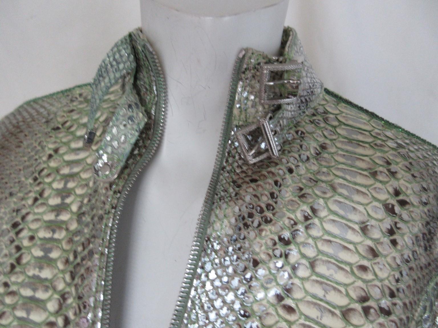 Fabulous original jacket in mint/silver color 100% pithon leather from Aphero

We offer more exclusive vintage leather and fur items, view our frontstore

Details:
2 zipper pockets and zipperclosure
Silver details at collar and sleeves
Fully