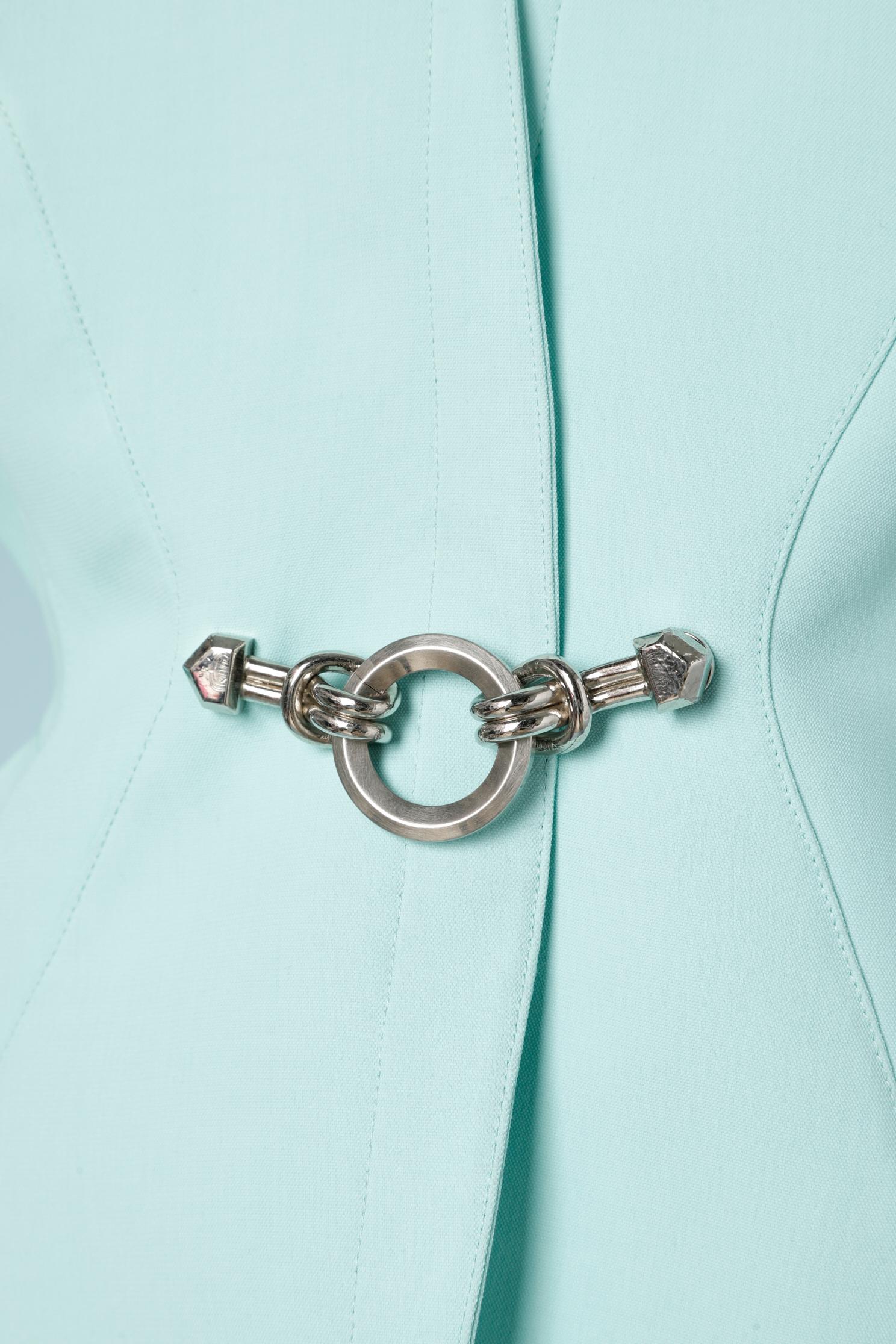 Mint skirt- suit with metal embellishment.
SIZE: 42 ( Fr)
