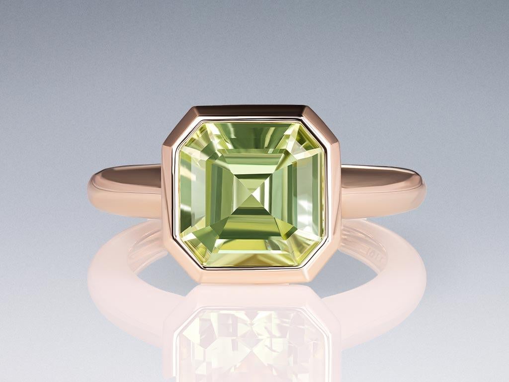 Discover unparalleled elegance with our exquisite ring featuring a rare 5.13-carat Mint-Green Tourmaline, sourced from the enchanting landscapes of Congo. Set in 18k champagne gold, this ring showcases a central gemstone that captures the essence of
