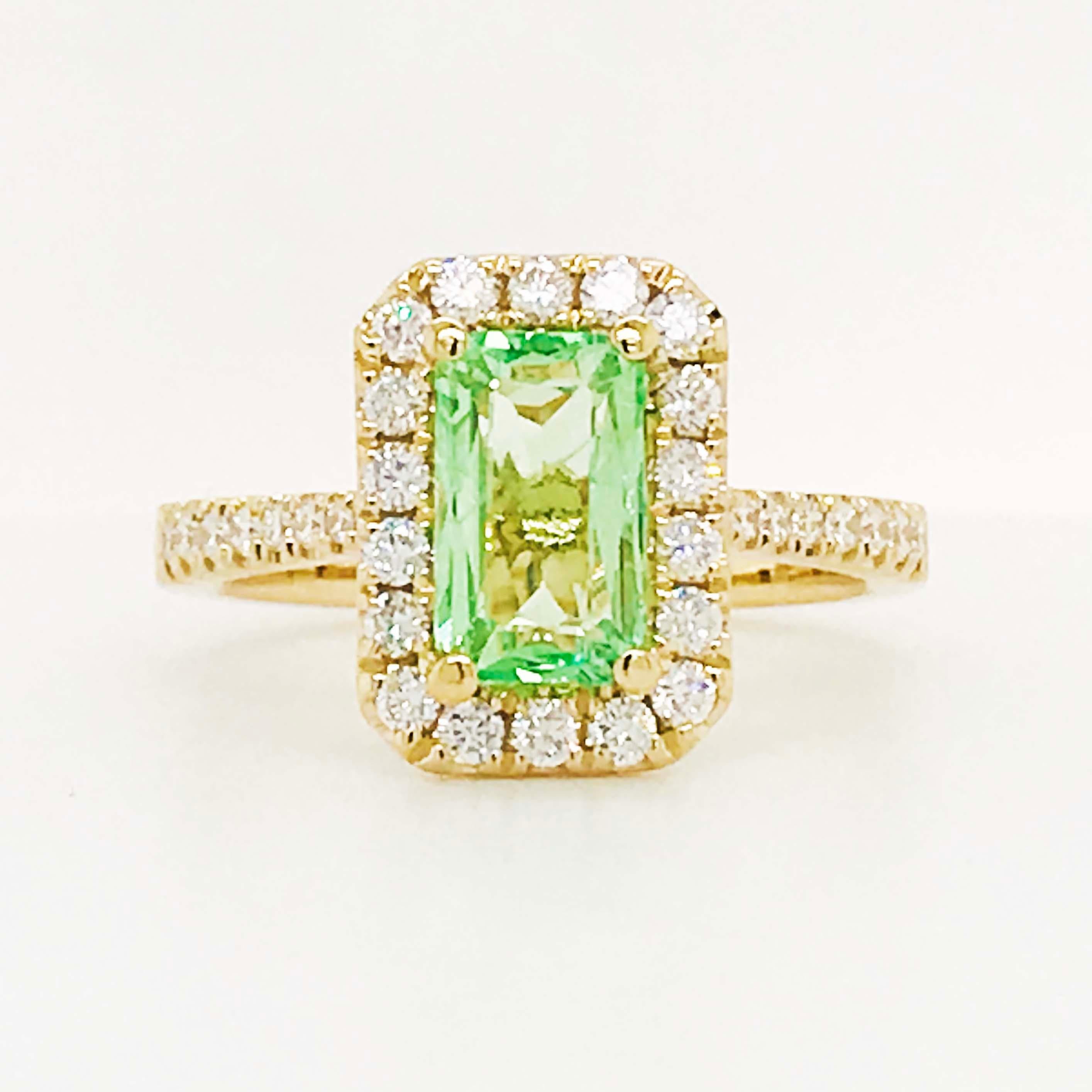 Stunning mint green tourmaline gemstone set in a unique designer setting! This ring was created by first starting with the center gemstone. The unusual and vibrantly light mint green tourmaline reflects the light so well and is well paired with our