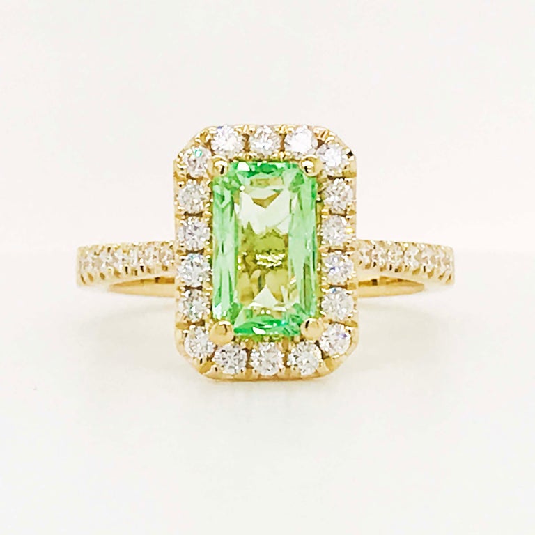 Stunning mint tsavorite garnet gemstone set in a unique designer setting! This ring was created by first starting with the center gemstone. The tsavorite is this Gemologists favorite gemstone. The gemstone reflects the light so well and is well