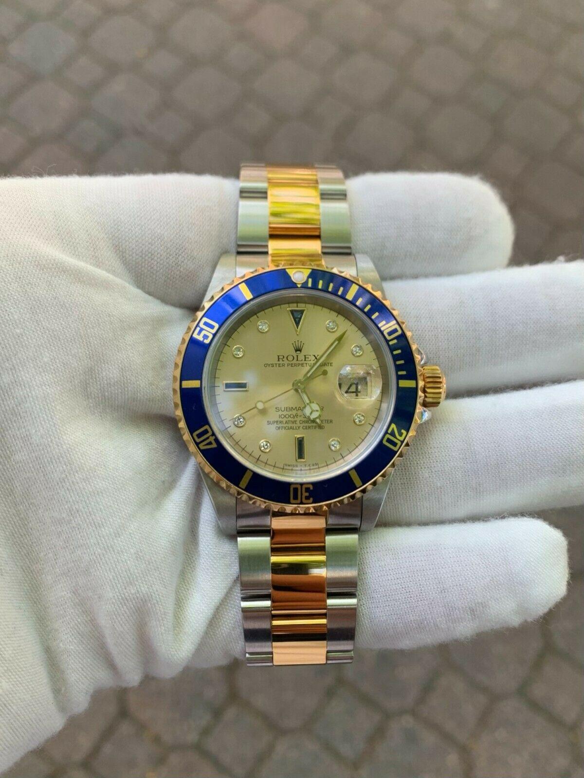This amazingly and super well-kept Rolex Submariner comes with its original box and papers and remains in excellent physical and mechanical condition. The dial is adorned with genuine round single cut diamonds and custom cut sapphires. The rotating