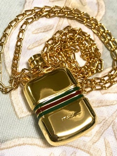 MINT. Vintage Gucci golden mini perfume, eau de cologne bottle necklace.