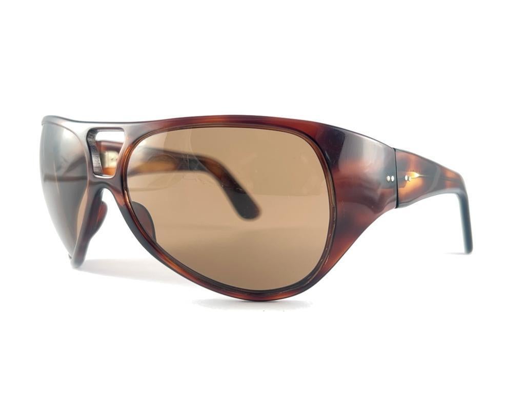 A True Iconic Museum Piece Philippe Chevallier Light Tortoise Oversized Frame Sporting A Beautiful Pair Of Medium Brown Lenses. 

This Item Show Minor Sign Of Wear On The Lenses Due To More Than 50 Years Of Storage

This Pair Of Vintage Philippe