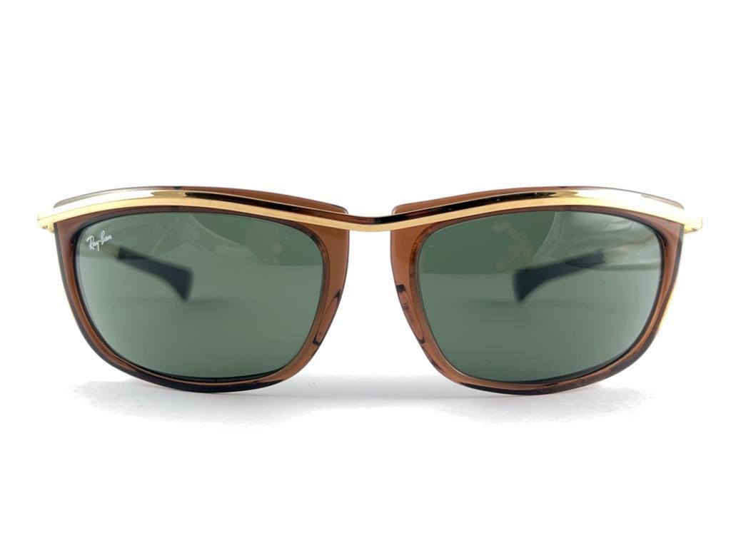 
Mint Vintage Ray Ban Olympia Gold And Brown Frame Holding A Pair Of G15 Grey Lenses.
This Pair Show Minor Sign Of Wear Due To Storage.



Designed And Produced In Usa


Front                                                             15 Cms 
Lens