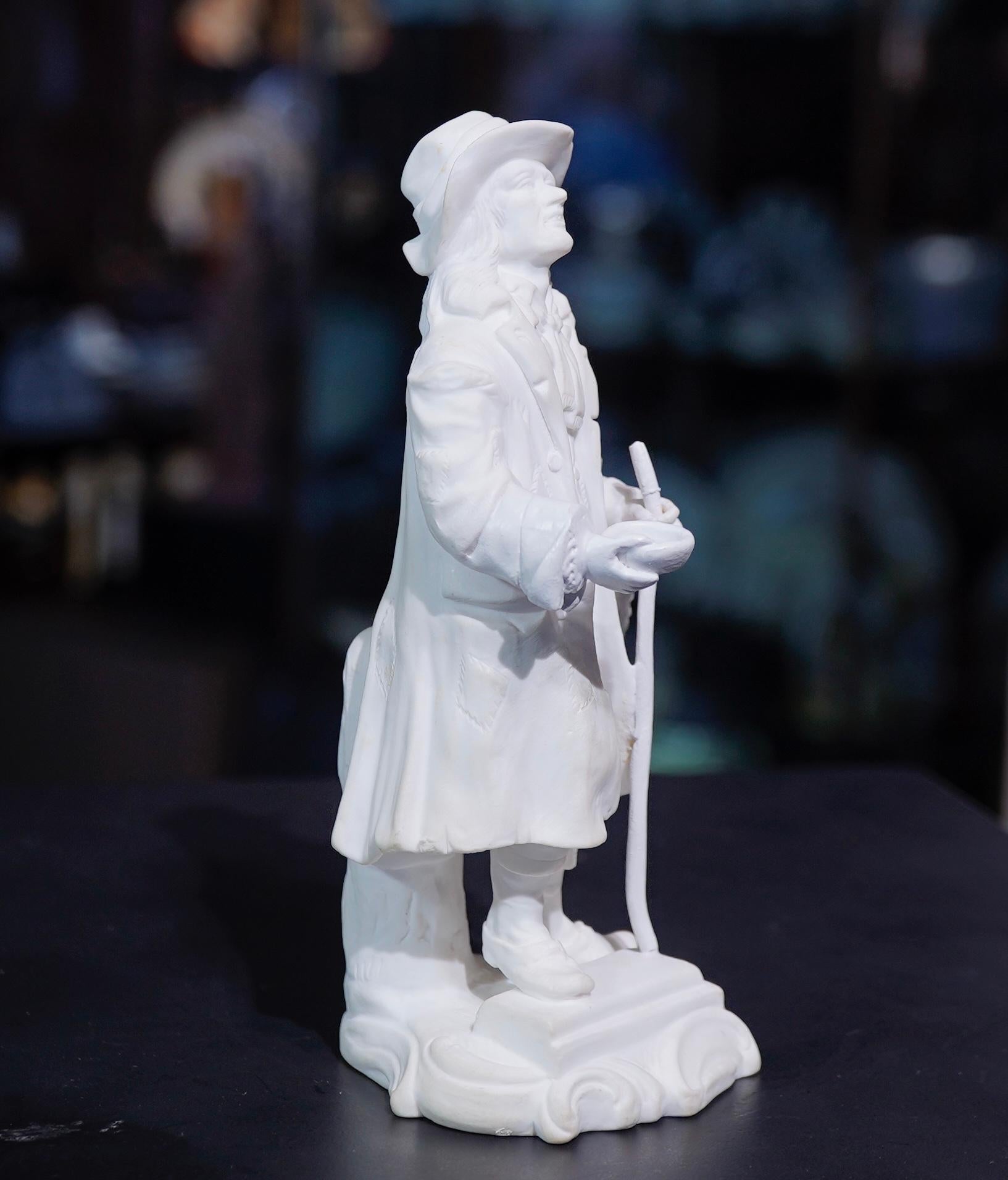 Minton bisque porcelain figure of a beggar, modelled standing in loose and patched clothing, a staff in one hand, a bowl in the other.
Unmarked, no.95 in the original Minton model book,
circa 1835

Ref Godden ‘Minton’ p93 for the listing, no.95-