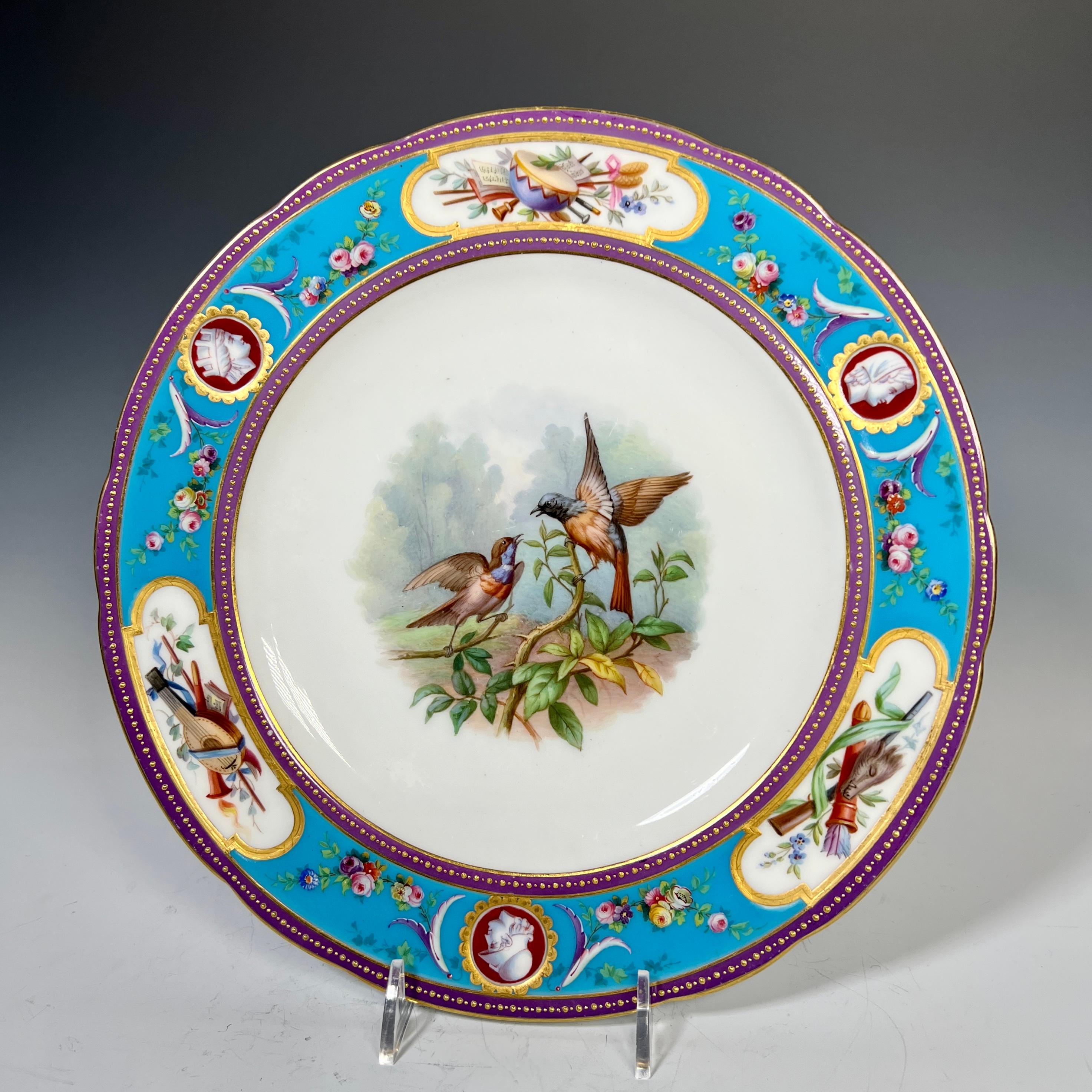 A rare and exceptional 19th century Minton dessert service featuring hand painted ornithological subjects hand painted in the neoclassical period consisting of 10 dessert plates and 2 footed compotes. The centers depict different bird subjects, each