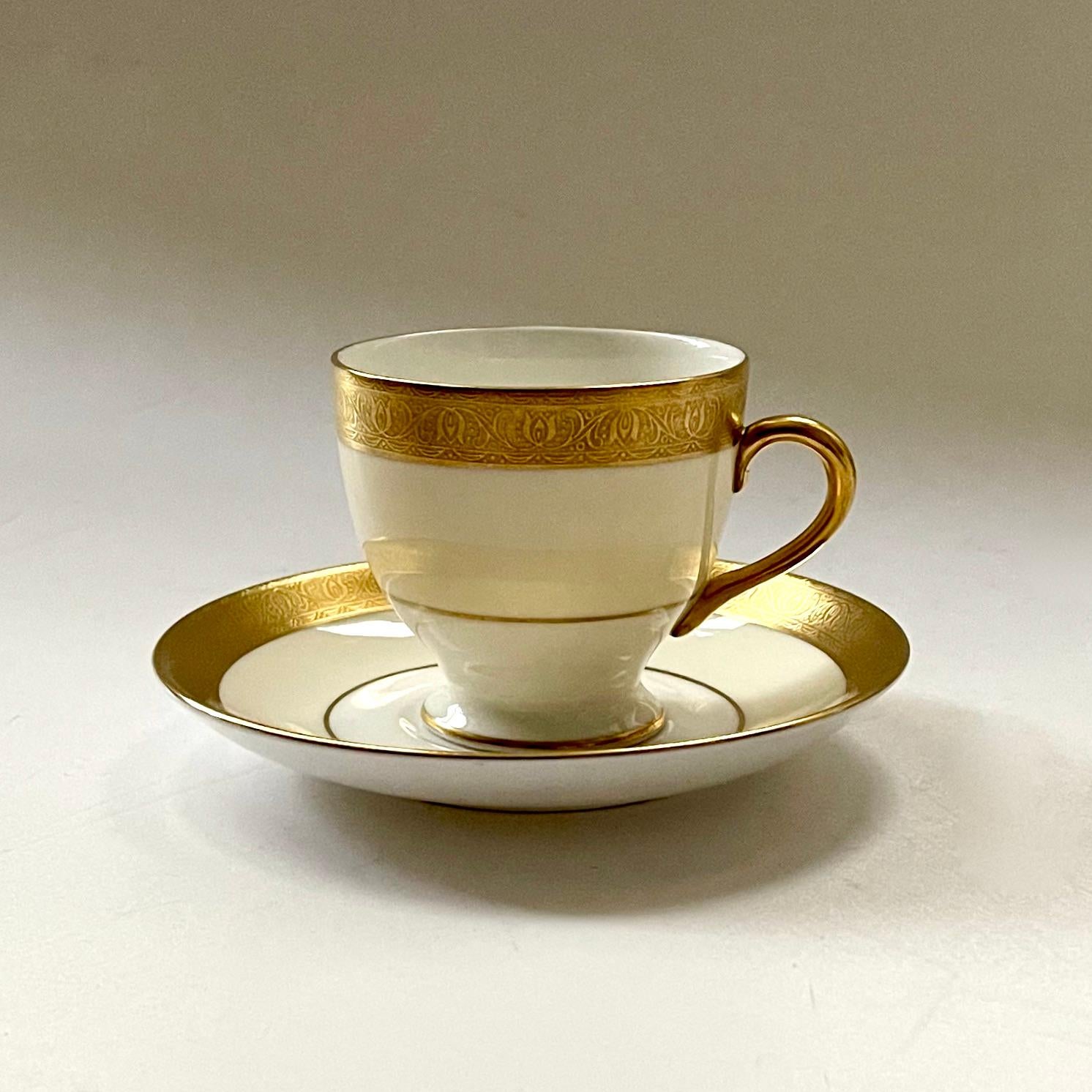 A beautiful and classic 115 piece Fine Bone China service by Minton in their exemplary Buckingham pattern ‘K-159’, first designed in 1929 and now discontinued. The outer body or rim of each piece is in cream, with a heavy encrusted gold border with