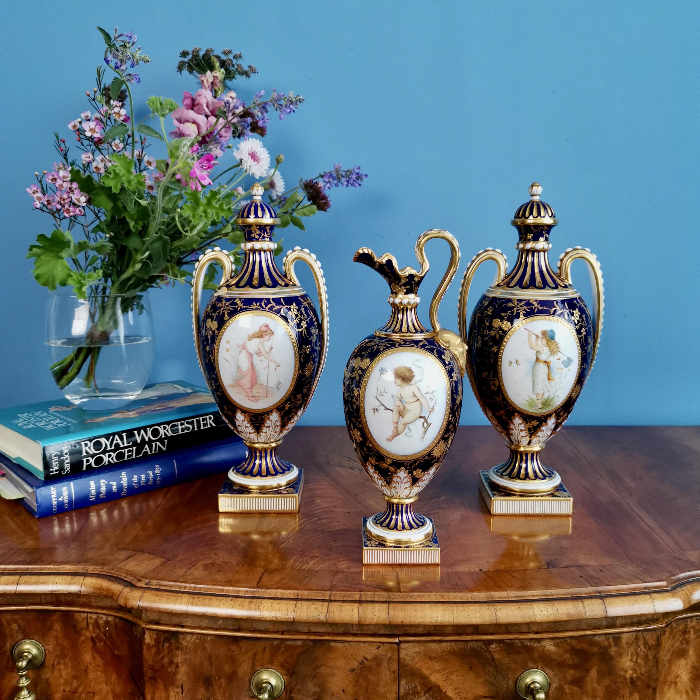 This is a stunning garniture consisting of two lidded vases and a ewer, made by Minton in 1891 and painted by the famous porcelain artist Antonin Boullemier.

Minton was one of the pioneers of English china production alongside other great potters